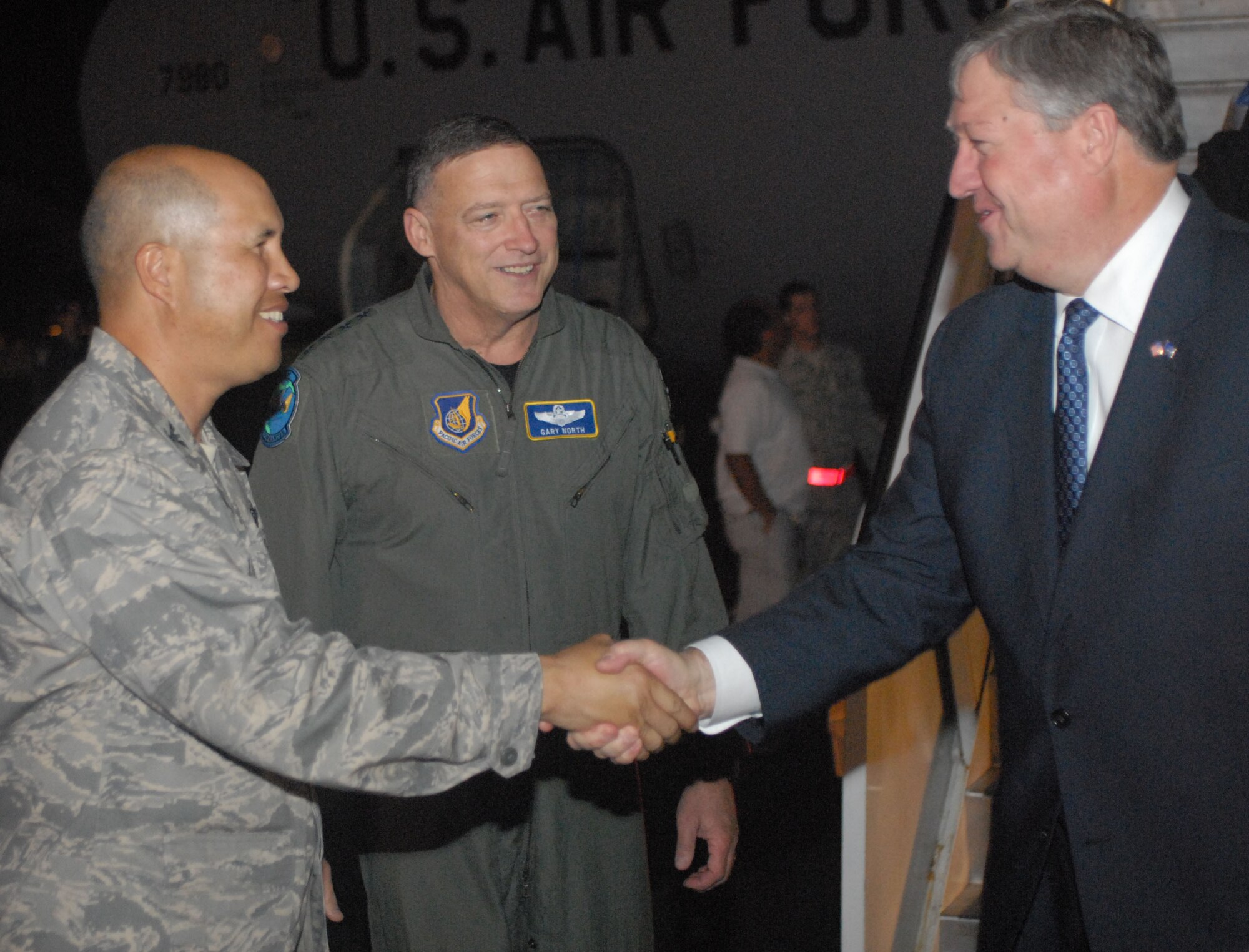 HICKAM AIR FORCE BASE, Hawaii - Colonel Giovanni K. Tuck, 15th Airlift Wing commander, and General Gary L. North, Pacific Air Forces commander, welcomes the Honorable Michael B. Donley, Secretary of the United States Air Force upon his arrival here, Dec. 17. Hickam Air Force Base is his first stop of his tour of air bases in PACAF. PACAF is responsible for Air Force activities spread over half the globe in a command that supports 45,000 Air Force people serving principally in Hawaii, Alaska, Guam, Korea, and Japan. (U.S. Air Force photo/Senior Airman Gustavo Gonzalez)