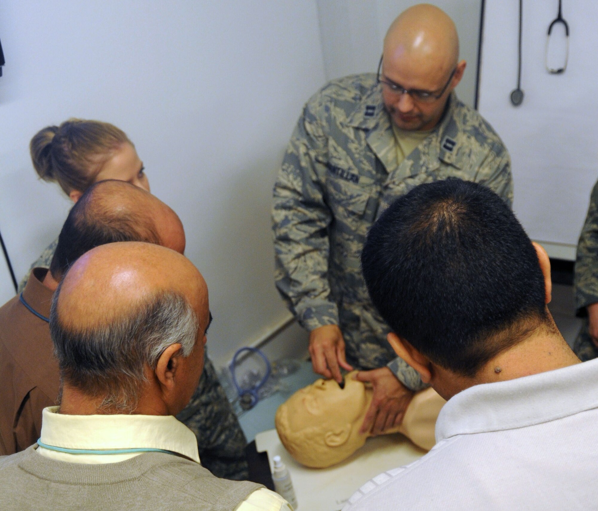 Capt. Fredrick Santillan teaches airway techniques to Iraqi nurses and nursing students Dec. 9, 2009, as part of the Iraqi Nursing Partnership Program conducted monthly at the Air Force Theater Hospital at Joint Base Balad, Iraq. The students begin each class with a lecture covering the day's primary topic and then complete a hands-on portion, when they put those teachings into practice. Captain Santillan is a 332nd Expeditionary Medical Group registered nurse. (U.S. Air Force photo/Airman 1st Class Brittany Y. Bateman)