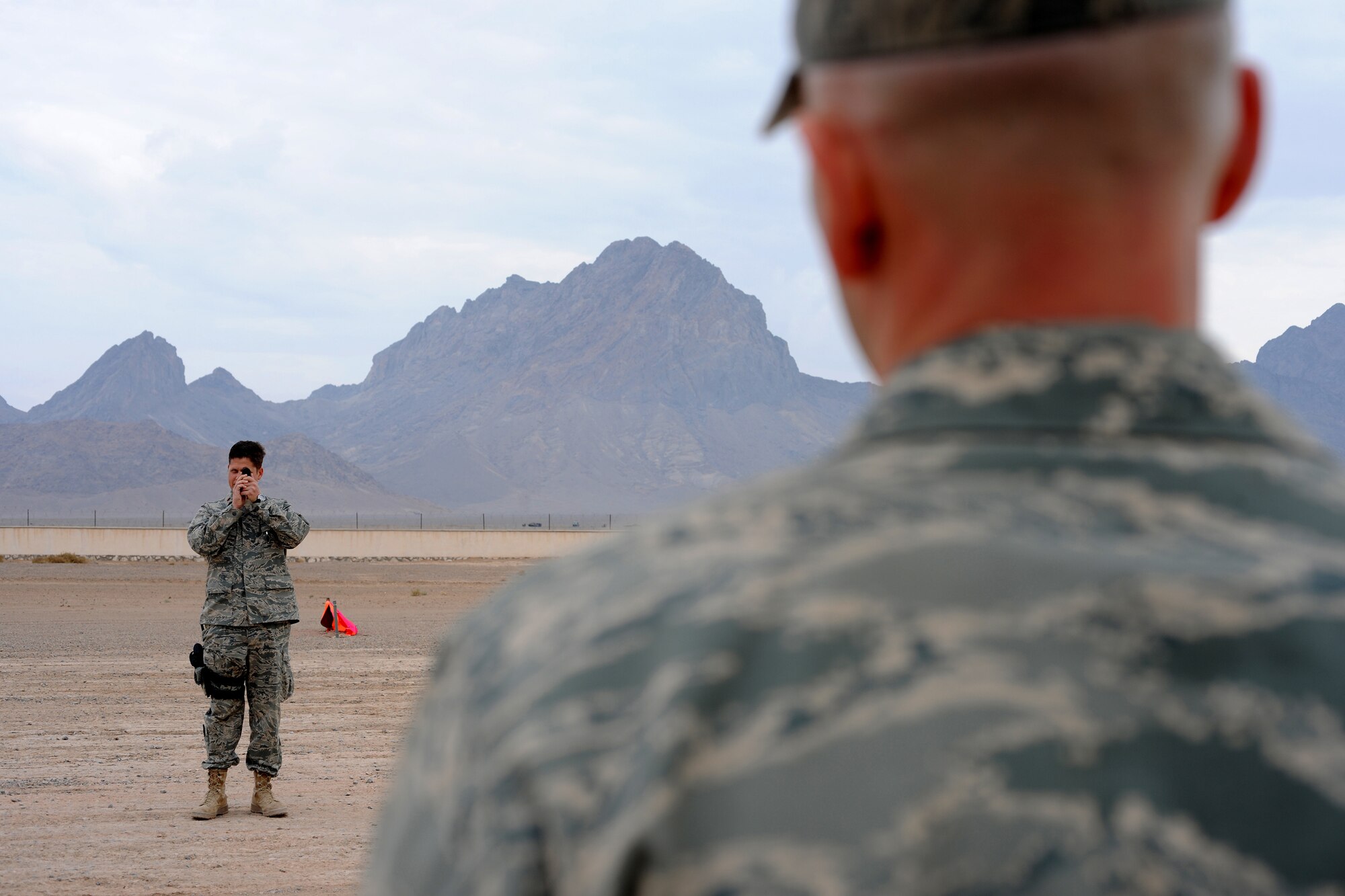 Maj. Blane Rasch takes landing zone gradients at Forward Operating Base Farah, Afghanistan, Dec. 2, 2009. A team deployed to Afghanistan to visit all established airfields with a major military presence. The results of their study will be briefed to the International Security Assistance Force commander. The ultimate goal of the team is to help find solutions for getting more forces into the war zone and sustaining those forces once they are in place. Major Rasch is a C-130 Hercules pilot and member of an Air Force airfield assessment team from the 621st Contingency Response Wing at Joint Base McGuire, N.J. (U.S. Air Force photo)