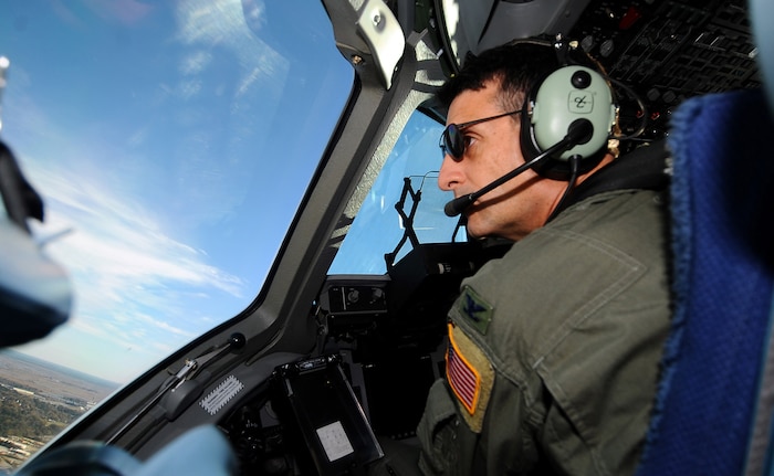 Col. Joseph Mancy pilots a C-17 during a strategic brigade airdrop training mission Dec. 16, 2009. In all, more than 300 active-duty, Reserve and Guard Airmen and Soldier participated in the exercise. Colonel Mancy is the 437th Operations Group commander. (U.S. Air Force photo/Master Sgt. Shane Cuomo)(Released)