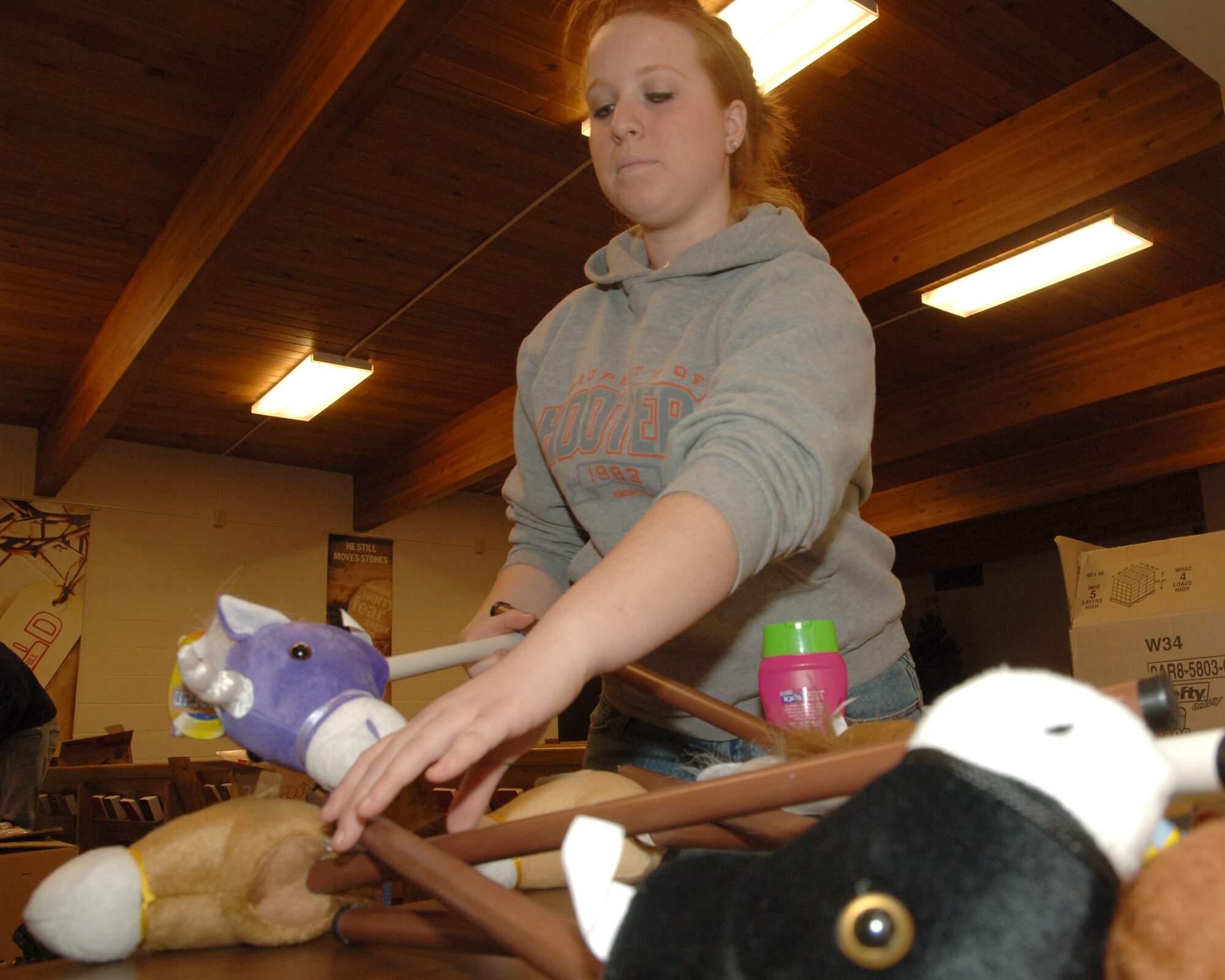 Airman 1st Class Christin E. Smith, 319th Logistic Readiness Squadron, sorts out different toys Dec. 17 at a local Salvation Army.  More than 25 Airmen spent Dec. 11 through Dec. 18 helping the local Salvation Army prepare toy bags and food boxes for 420 families in Grand Forks County and the city of East Grand Forks. (U.S. Air Force photo by Senior Airman R. Michael Longoria)