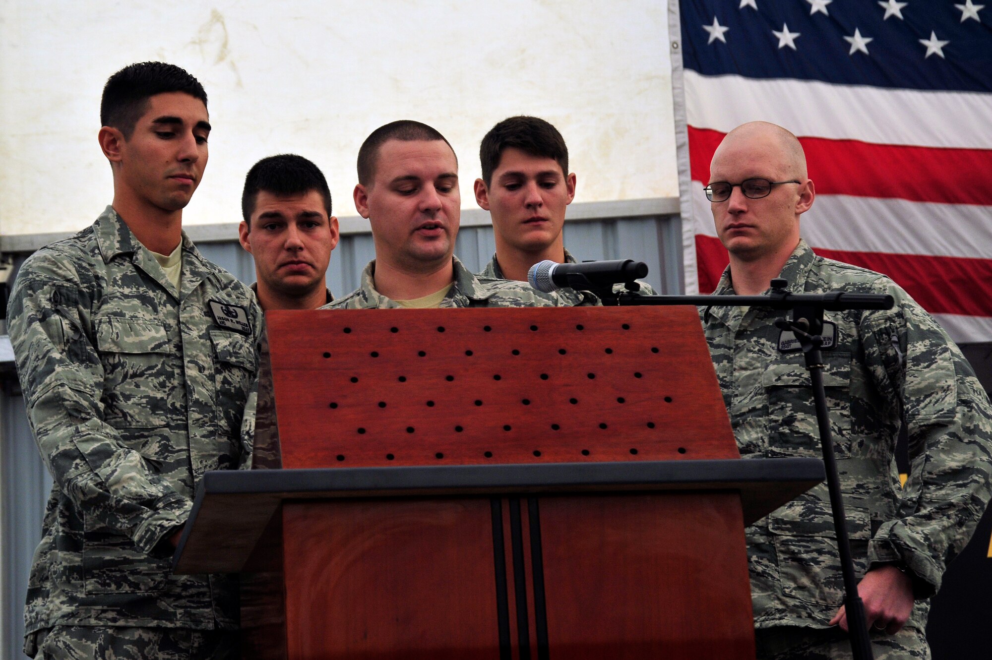SOUTHWEST ASIA – The 380th Expeditionary Civil Engineer Squadron explosive ordnance disposal team members explain the meaning of the EOD profession badge during a memorial ceremony Dec. 18, 2009. Tech. Sgt. Anthony Campbell Jr., 380th Expeditionary Civil Engineer Squadron, was killed in action while forward-deployed as an explosive ordnance disposal member in Afghanistan. (U.S. Air Force photo/Tech. Sgt. Charles Larkin Sr)