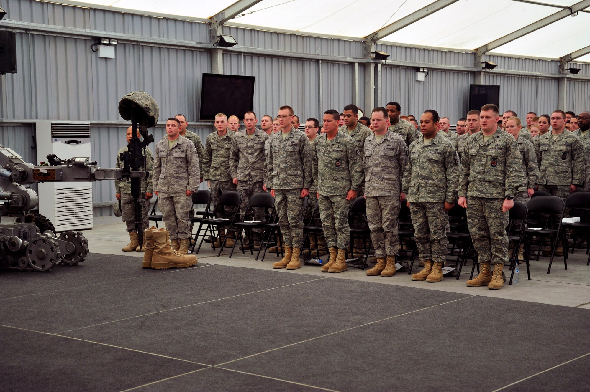 SOUTHWEST ASIA - 380th Expeditionary Civil Engineer Squadron recite the Airman's Creed during a memorial ceremony Dec. 18, 2009. The ceremony was in remembrance of Tech. Sgt. Anthony Campbell Jr., 380th Expeditionary Civil Engineer Squadron, who was killed in action while forward-deployed as an explosive ordnance disposal member in Afghanistan. (U.S. Air Force photo/Tech. Sgt. Charles Larkin Sr)