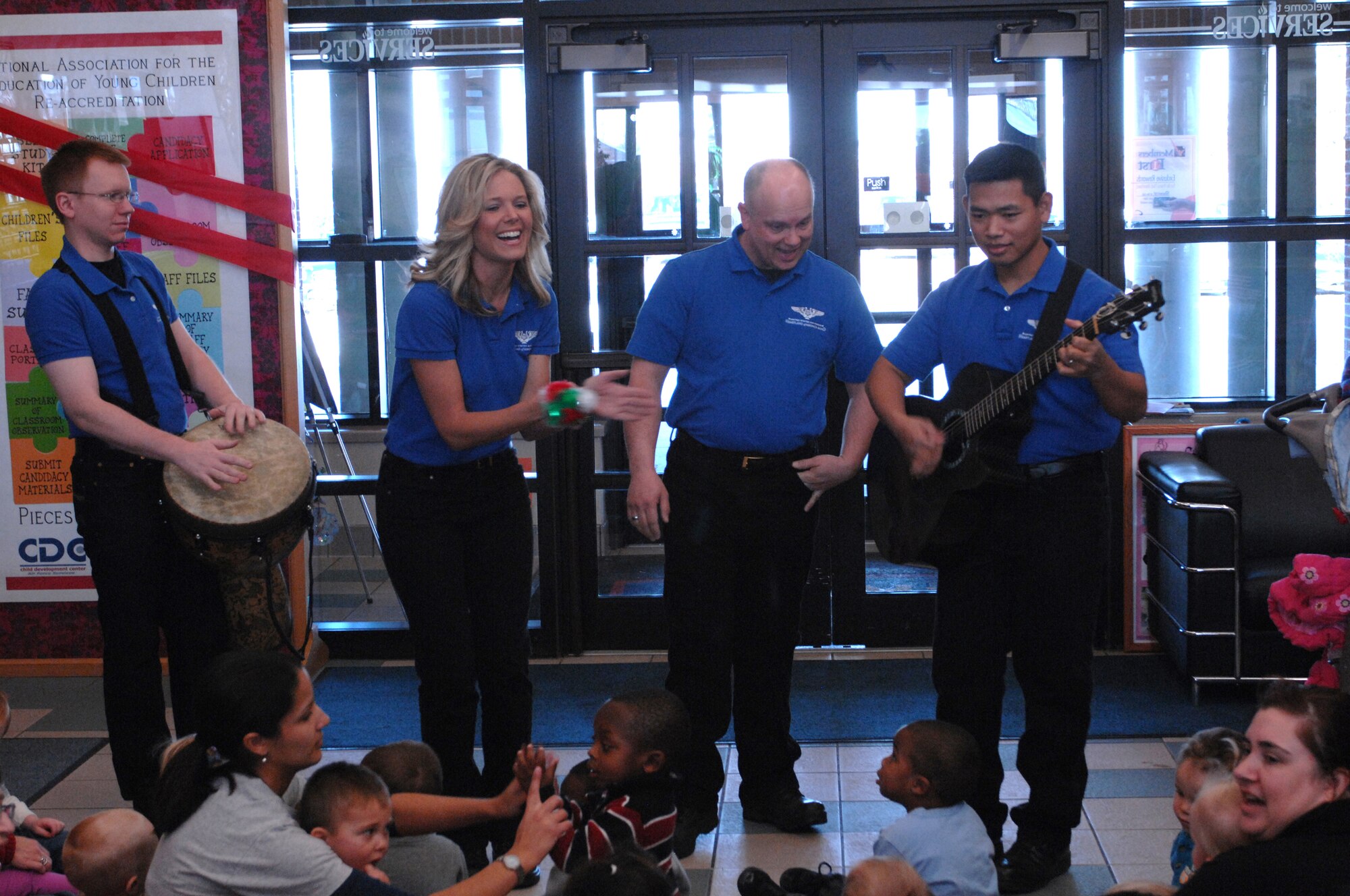 MINOT AIR FORCE BASE, N.D. -- Night Wing performs Christmas carols to military members children at the Child Development center here Dec. 16. Night Wing is a part of Heartland of America Band and travels to various bases to sing to Air Force members to boost morale. (U.S. Air Force photo by Airman 1st Class Aaron-Forrest Wainwright) 