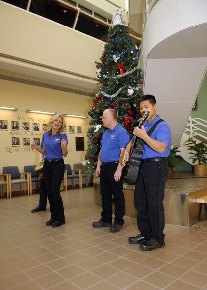 MINOT AIR FORCE BASE, N.D. -- Night Wing performs Christmas carols to military members at the 5th Medical Group Atrium here Dec. 16. Night Wing is part of the United States Air Force Heartland of America Band that provides innovative and professional music to global audiences. (U.S. Air Force photo by Airman 1st Class Ashley N. Avecilla) 