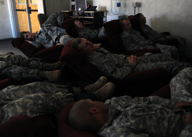 Airborne Soldiers from the 2-319th Airborne Field Artillery, 82nd Airborne Division, Ft. Bragg, N.C., rest after being airdropped during a strategic brigade airdrop exercise over North Auxiliary Airfield near Northern, S.C., Dec. 16. 2009. The training mission also included airdrops over North Auxiliary Airfield, aerial refueling training and simulated aeromedical evacuation. (U.S. Air Force photo/Senior Airman Katie Gieratz)(Released)