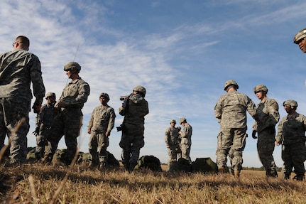 Airborne Soldiers from the 2-319th Airborne Field Artillery, 82nd Airborne Division, Ft. Bragg, N.C., meet at the rally point during a strategic brigade airdrop exercise over North Auxiliary Airfield near Northern, S.C., Dec. 16. 2009. The Soldiers were airdropped in the exercise along with cargo pallets to simulate the seizure of a remote airfield, providing a joint training opportunity for the Airmen and Soldiers. The training mission included cargo airdrops over North Auxiliary Airfield, aerial refueling training and simulated aeromedical evacuation. (U.S. Air Force photo/Senior Airman Katie Gieratz)(Released)