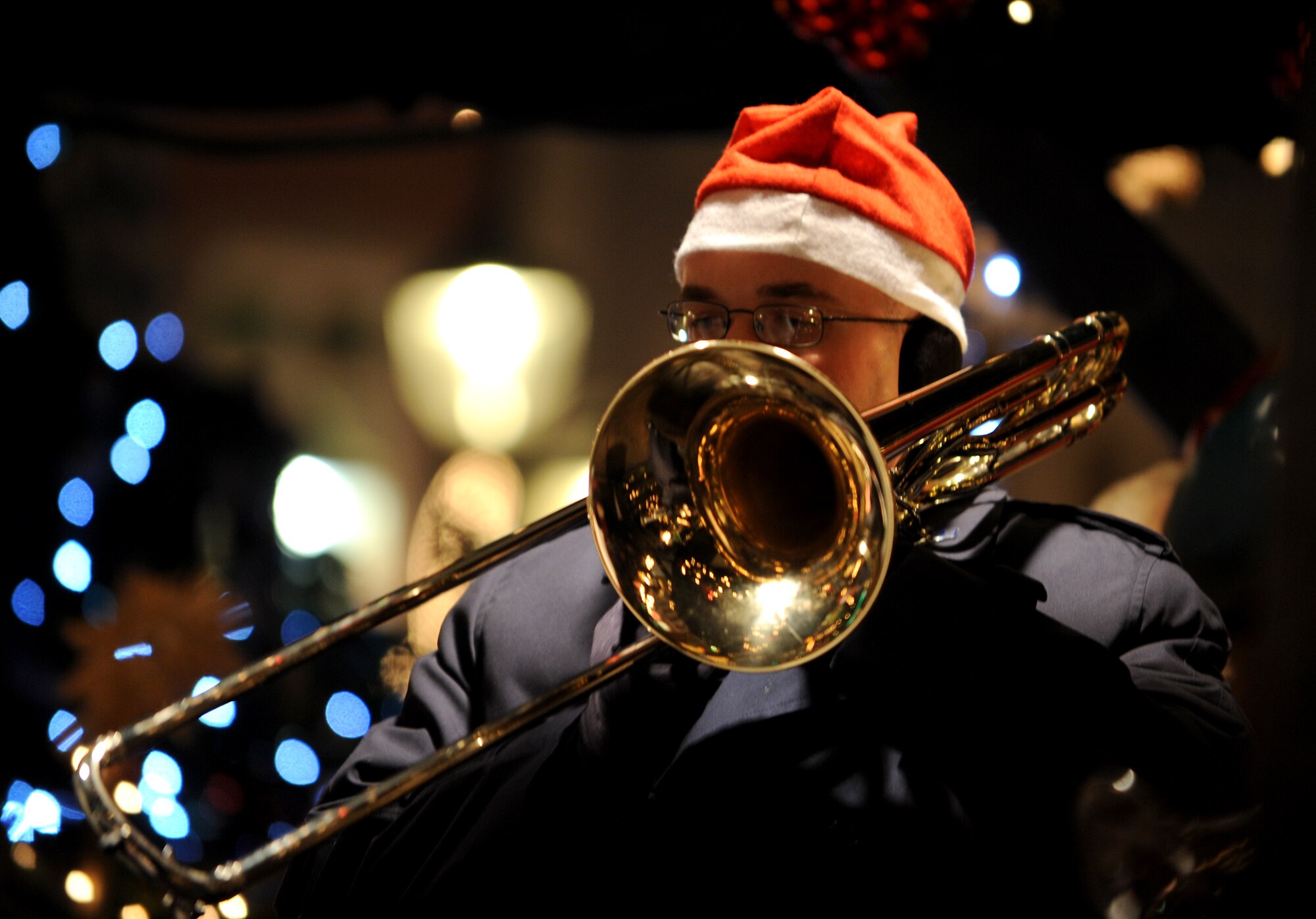 TRIER, Germany -- Staff Sgt. Frank Gourley, U.S. Air Forces in Europe Band trombonist, plays “Jingle Bells” during a live performance by Five Star Brass Dec. 17 at the Trier Christmas Market. The USAFE band entertained Germans and Americans at the market with holiday songs. (U.S. Air Force photo/Airman 1st Class Nathanael Callon)