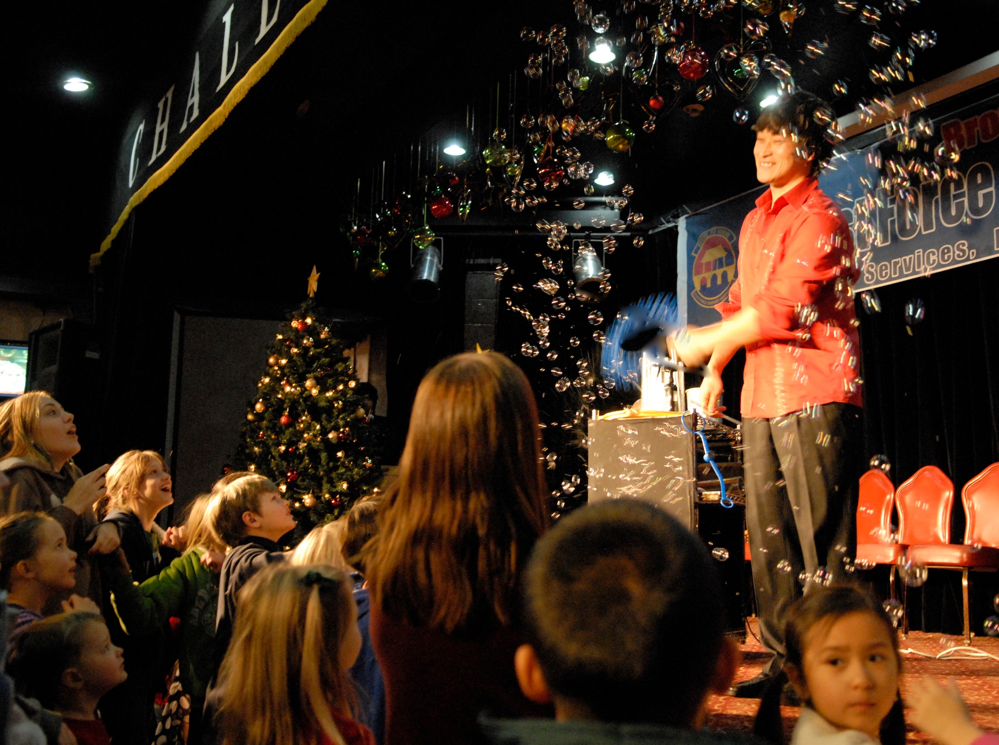 Team Osan children look on during a bubble show at the 51st Force Support Squadron's base-wide holiday party Dec. 18. (U.S. Air Force photo by 1st Lt. Chris Hoyler)