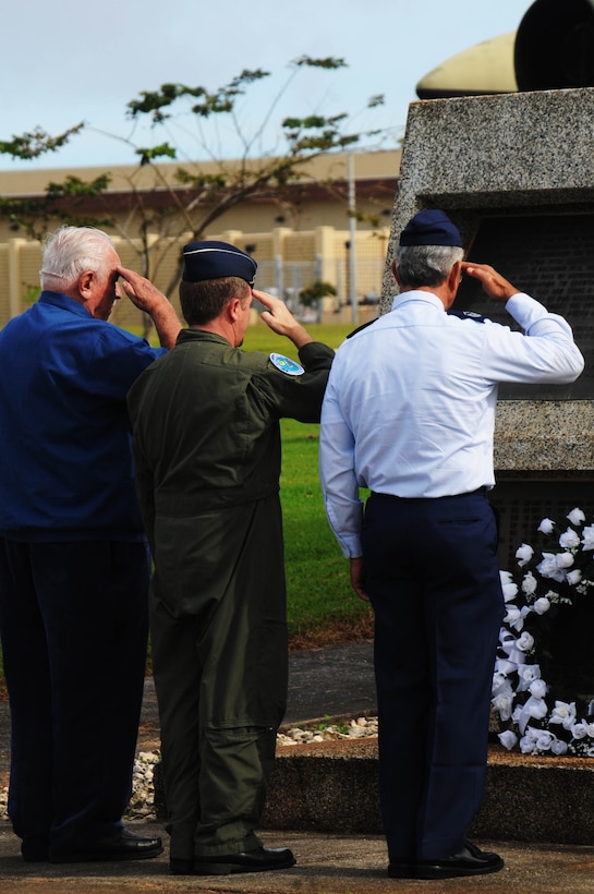 ANDERSEN AIR FORCE BACE, Guam - Brig. Gen. Phil Rulhman, 36th Wing commander, Lt. Col. (ret.) Charles "Chuck" McManus and Master Sgt. (ret) Felemenio "Pete" Chamberlain salute the wreath lain in honor of Operation Linebacker II at the Arc Light Memorial Park here Dec. 18. The ceremony commemorates the 37th anniversary of the campaign that led to the end of the Vietnam War. (U.S. Air Force Photo by Airman 1st Class Julian North)