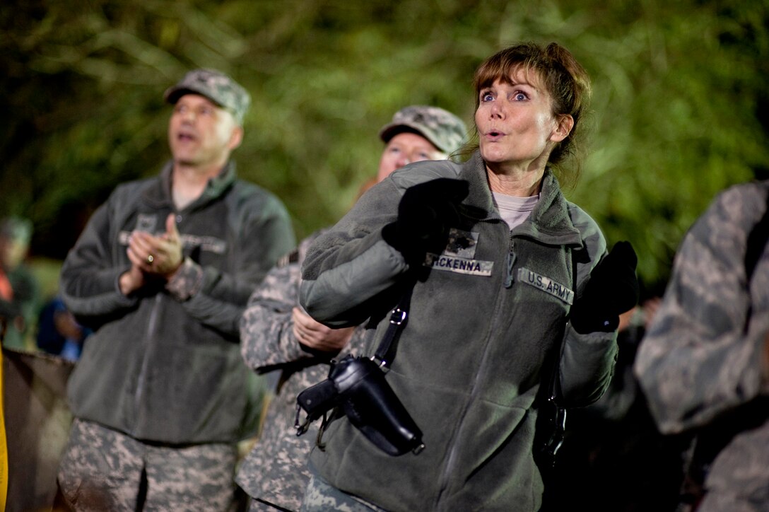 U.S. soldiers dance to the music as Billy Ray Cyrus performs during the 2009 USO Holiday Tour stop in Baghdad, Iraq, Dec. 18, 2009.