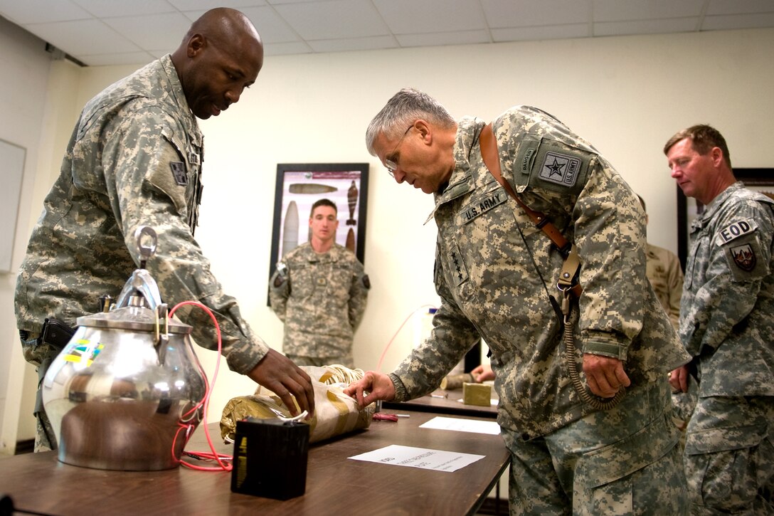 Army Sgt. Maj. Stokes shows Chief of Staff of the Army Gen. George W. Casey Jr.,  examples of what's being used in improvised explosive devices throughout Afghanistan during Casey's visit at Bahgram, Afghanistan, Dec. 17, 2009.  