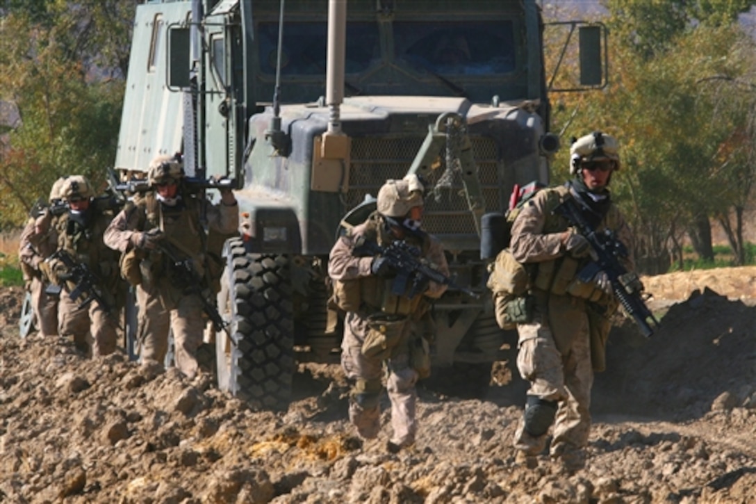 U.S. Marines conduct combat operations during Operation Cobra's Anger in Now Zad, Afghanistan, Dec.4, 2009. The operation disrupted enemy supply lines and communication in Now Zad, once a safe haven for Taliban forces. The Marines are assigned to the 3rd Battalion, 4th Marine Regiment.