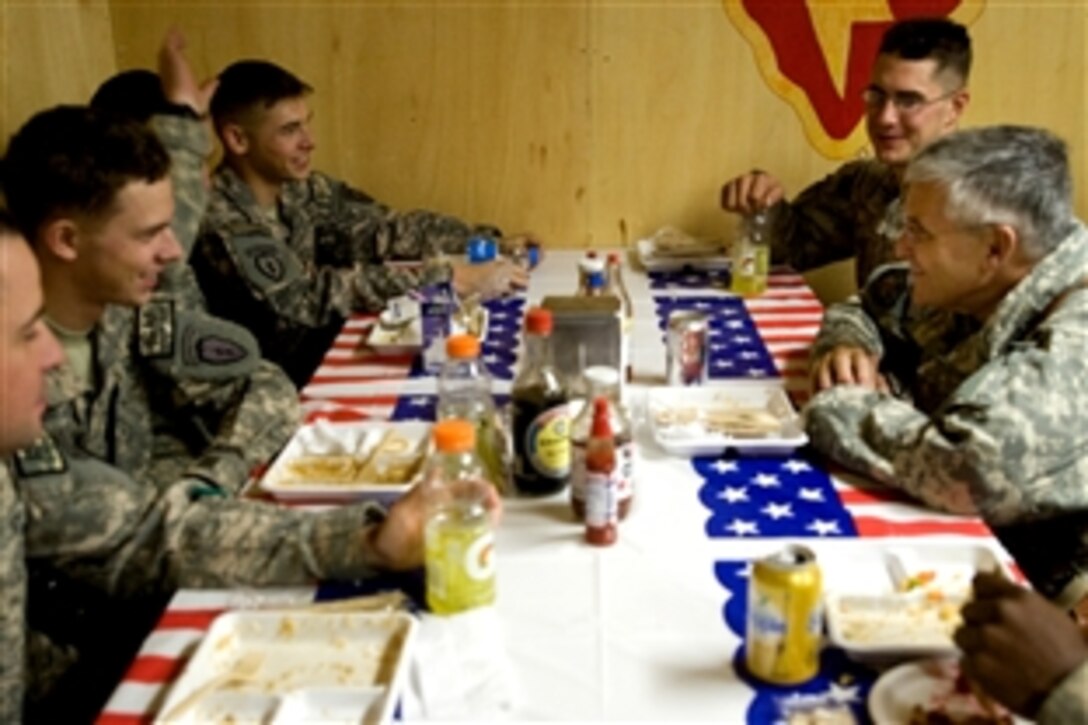 Chief of Staff of the Army, Gen. George W. Casey Jr., has lunch with soldiers at Combat Operating Base, Narizah, Afghanistan, Dec. 17, 2009. Casey is visiting soldiers around the world this holiday season to thank them for their service and inquiry on the conditions.