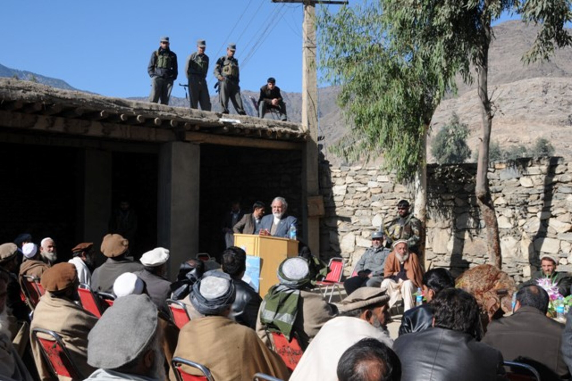 KUNAR PROVINCE, Afghanistan – Fazlullah Wahidi, Kunar provincial governor, speaks to the crowd following the dedication of a 4-kilometer road through Asadabad, the Kunar province capital, recently. The Provincial Reconstruction Team-Kunar engineers did a final quality assurance and quality check on the road prior to the ceremony to ensure the Kunar Construction Company did a good job building the road. The project took nearly one year and approximately $1 million to complete. The hope for the new road is it will continue to spur economic development and job growth in the city. More than 50 provincial leaders and tribal elders gathered at the ceremony site after the QA/QC check to do the ribbon cutting ceremony. (U.S. Air Force photo/Tech. Sgt. Brian Boisvert)