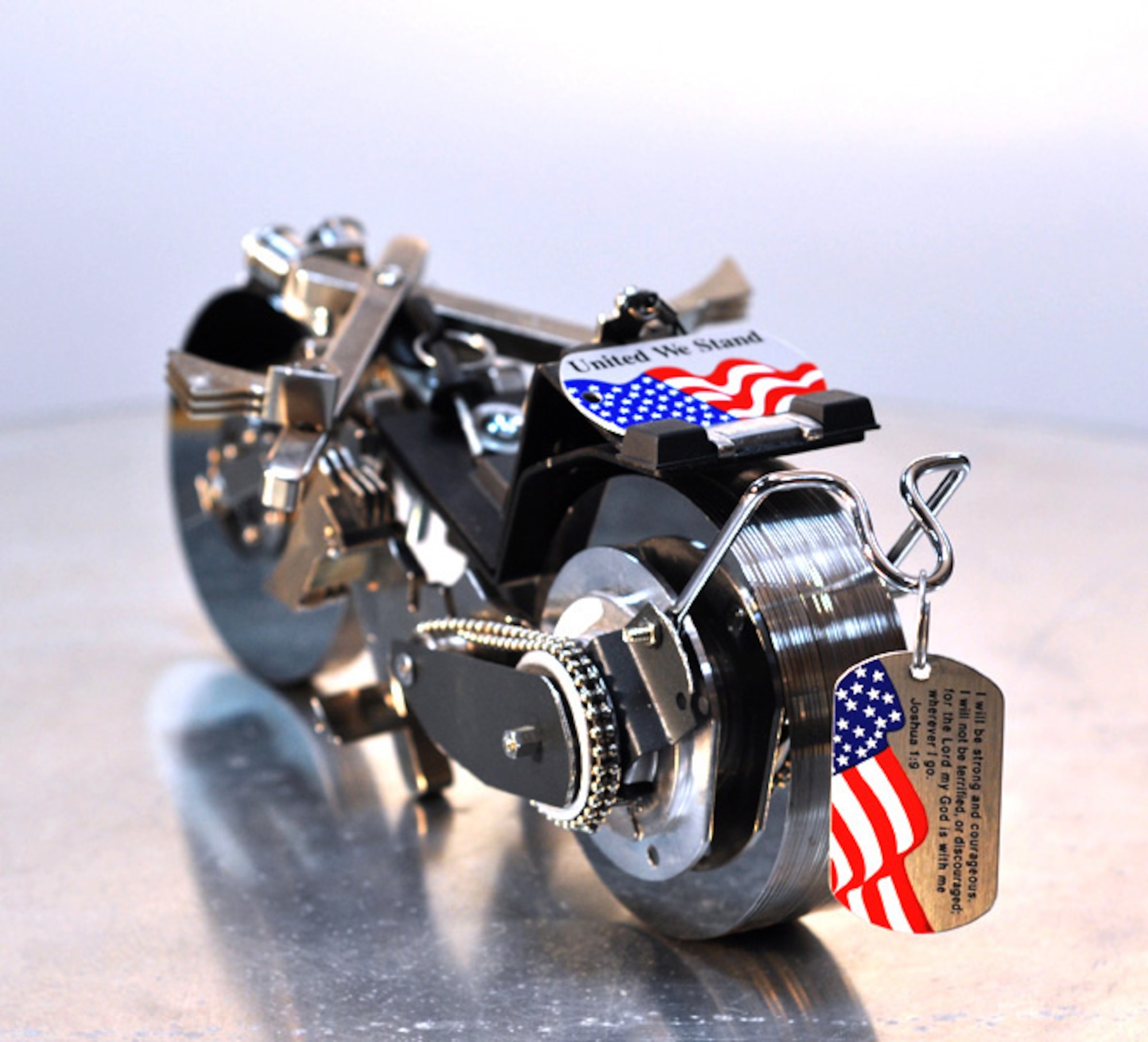 SOUTHWEST ASIA - Mr. Miguel Rivera, 386th Expeditionary Communications Squadron systems administrator, created this motorcycle sculpture from old hard drive components. The dog tags were given to him by a Navy chaplain and he added them to the sculpture as a tribute to all servicemembers. (Photo courtesy of Miguel Rivera) 