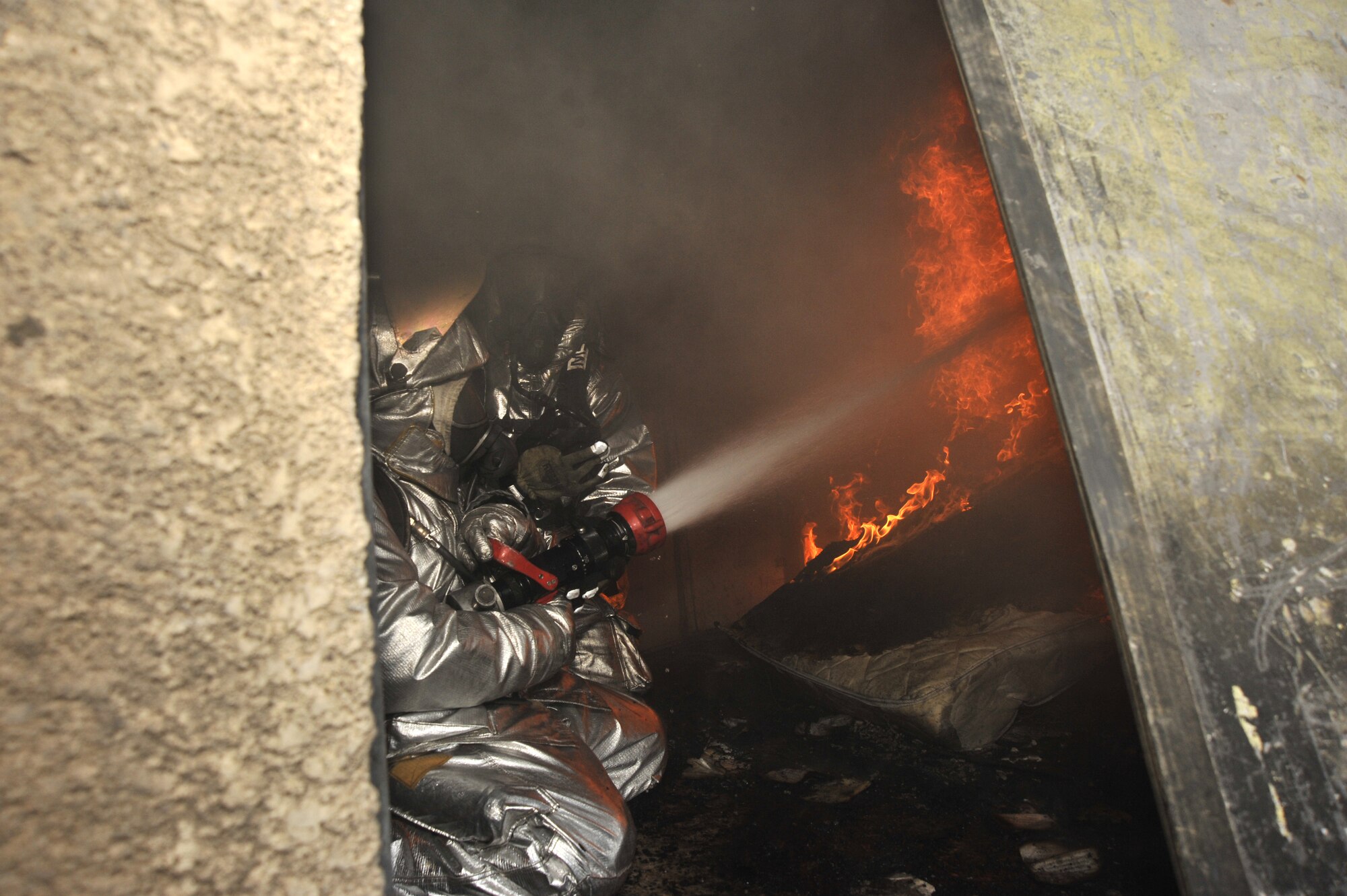 Iraqi firefighters battle blazing fires during a training exercise north of Sather Dec. 16, 2009. The Iraqi fire fighters, who have been trained by Air Force fire fighters, demonstrated thier capabilities to Major Gen. James Hunt, Multi-National Corps- Iraq deputy commander. (U.S. Air Force photo/ Senior Airman Eric Summers Jr./ released)