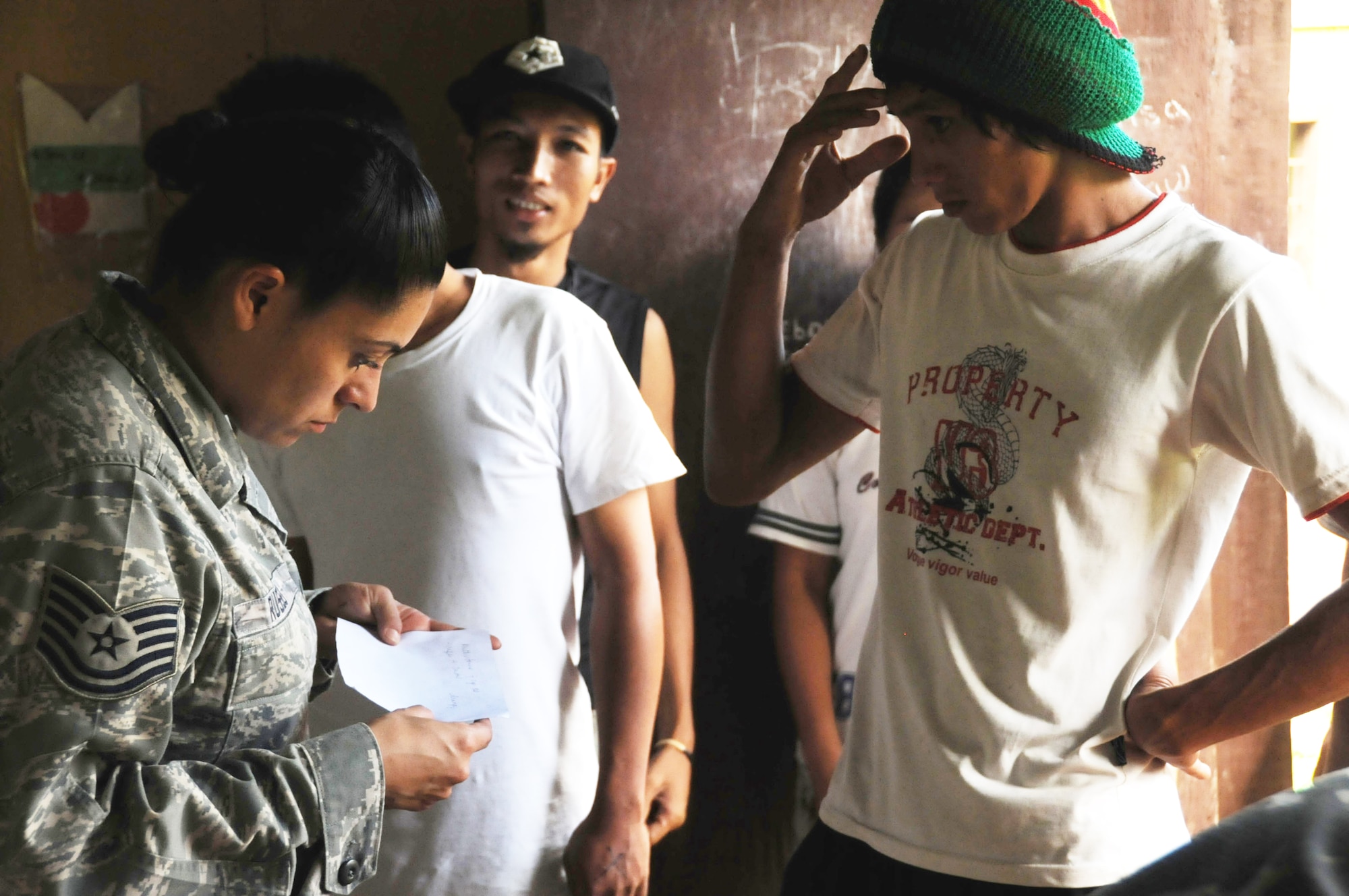 JOLO, Philippines -- Tech. Sgt. Sally Russo, an operating room technician assigned to Joint Special Operations Task Force-Philippines Forward Surgical Team, assists patients by helping to fill prescriptions at a recent medical civic action project here. Throughout the day, more than 200 patients received free check-ups, prescriptions, toiletries, and 10 residents received tooth extractions. Sergeant Russo is deployed from Yokota Air Base, Japan. (U.S. Navy photo/Lt.j.g. Theresa Donnelly)