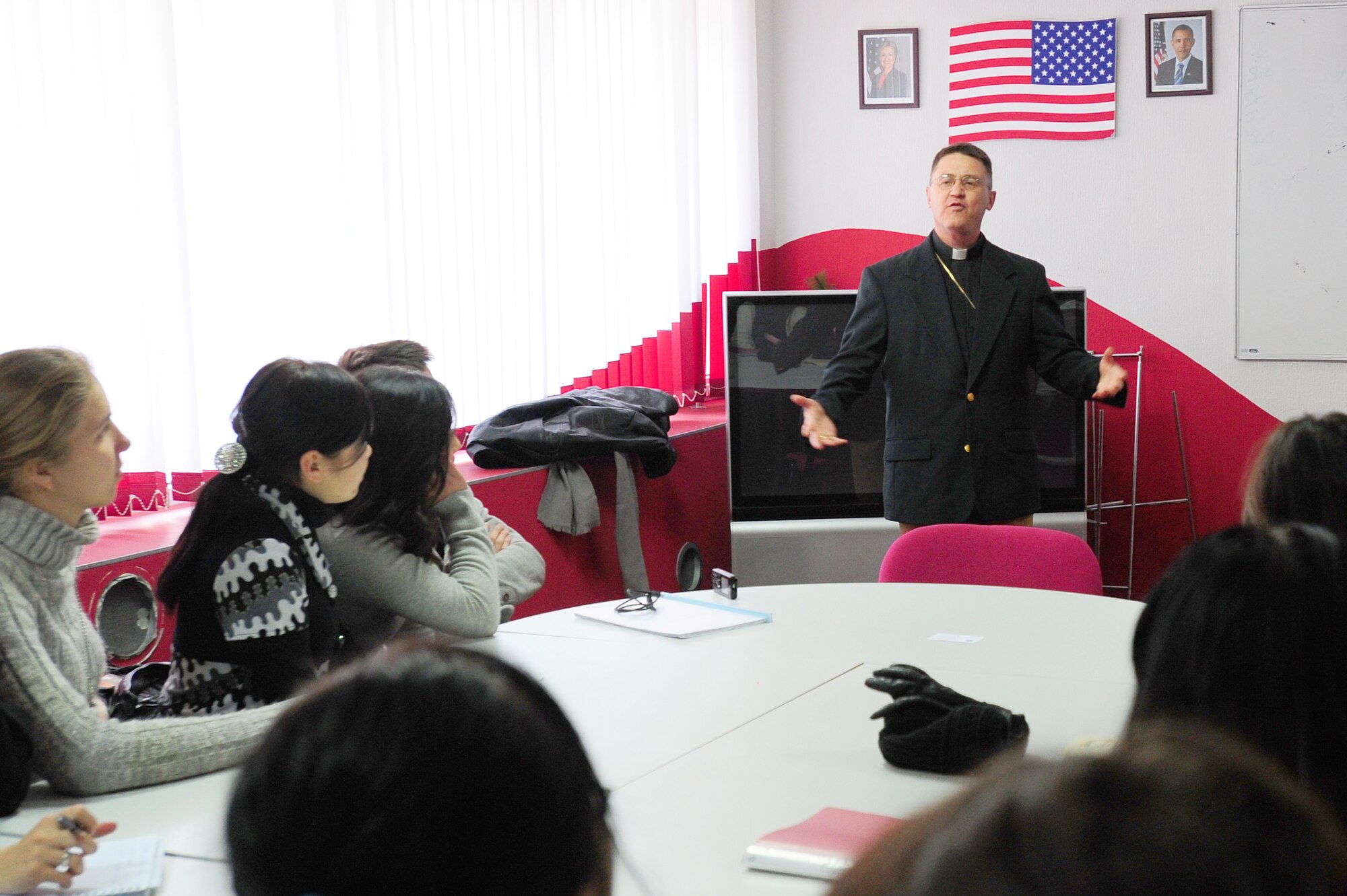 TRANSIT CENTER AT MANAS, Kyrgyzstan -- Lt. Col. Douglas Irmer, 376th Air Expeditionary Wing chaplain, speaks to religious studies students at the Kyrgyz-Russian Slavic University, Dec. 15, 2009. Chaplain Irmer and several others at the Transit Center have been talking at local universities about their career fields in the military and the Air Force missions in Kyrgyzstan and Afghanistan in support of Operation Enduring Freedom. Chaplain Irmer is deployed from the Nebraska Air National Guard's 155th Air Refueling Wing located in Lincoln, Neb. Colonel Irmer resides in Beatrice, Neb. (U.S. Air Force photo/Senior Airman Steele C. G. Britton)