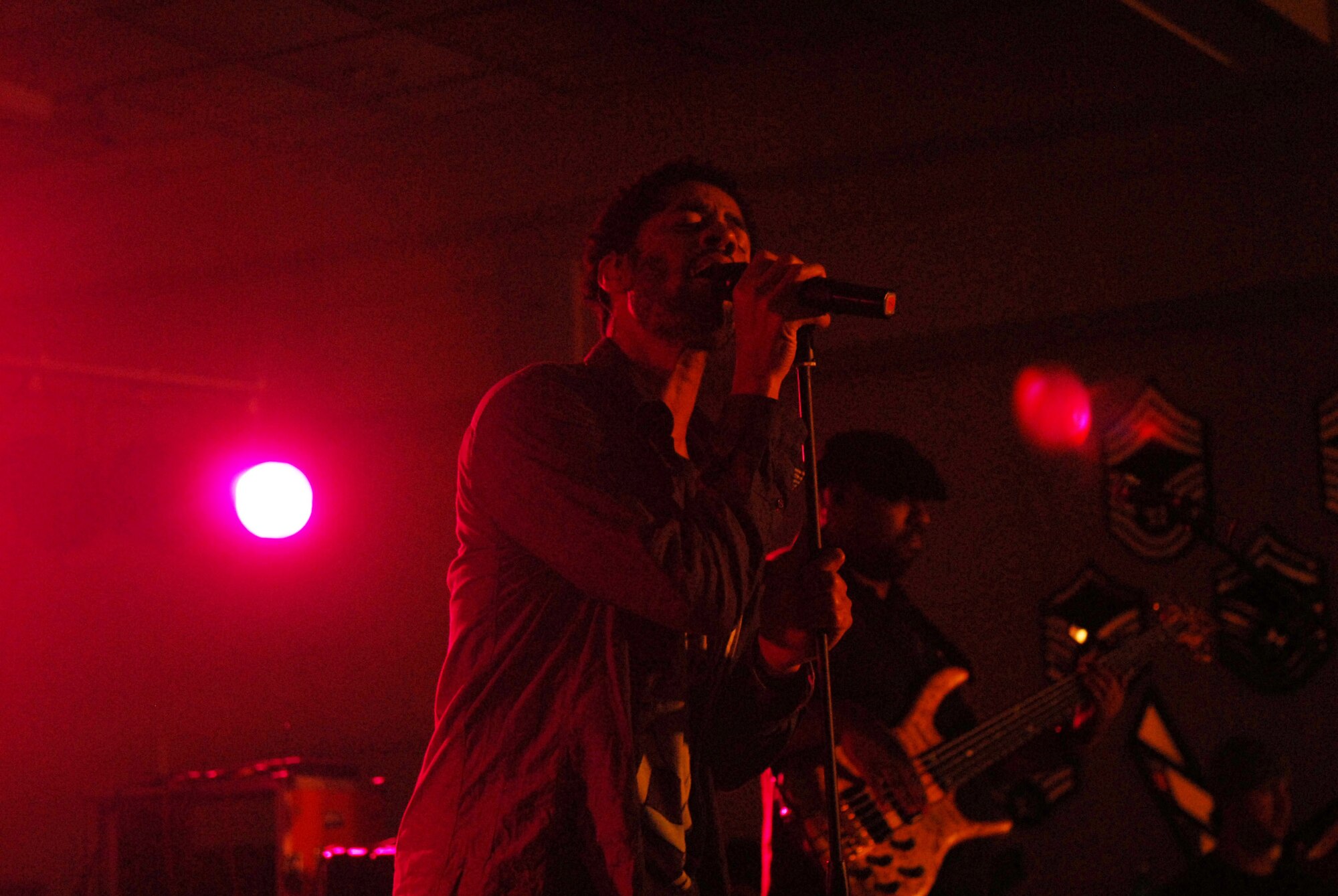 KUNSAN AIR BASE, Republic of Korea -- R and B recording artist Eric Benet sings to a crowd of more than 150 during a concert at the Loring Club here Dec. 15. Mr. Benet stopped by the Wolf Pack during his Pacific Armed Forces Entertainment tour. After the show, Mr. Benet took time to sign autographs and take pictures with Wolf Pack members. (U.S. Air Force photo by/Staff Sgt. Patrice Clarke)