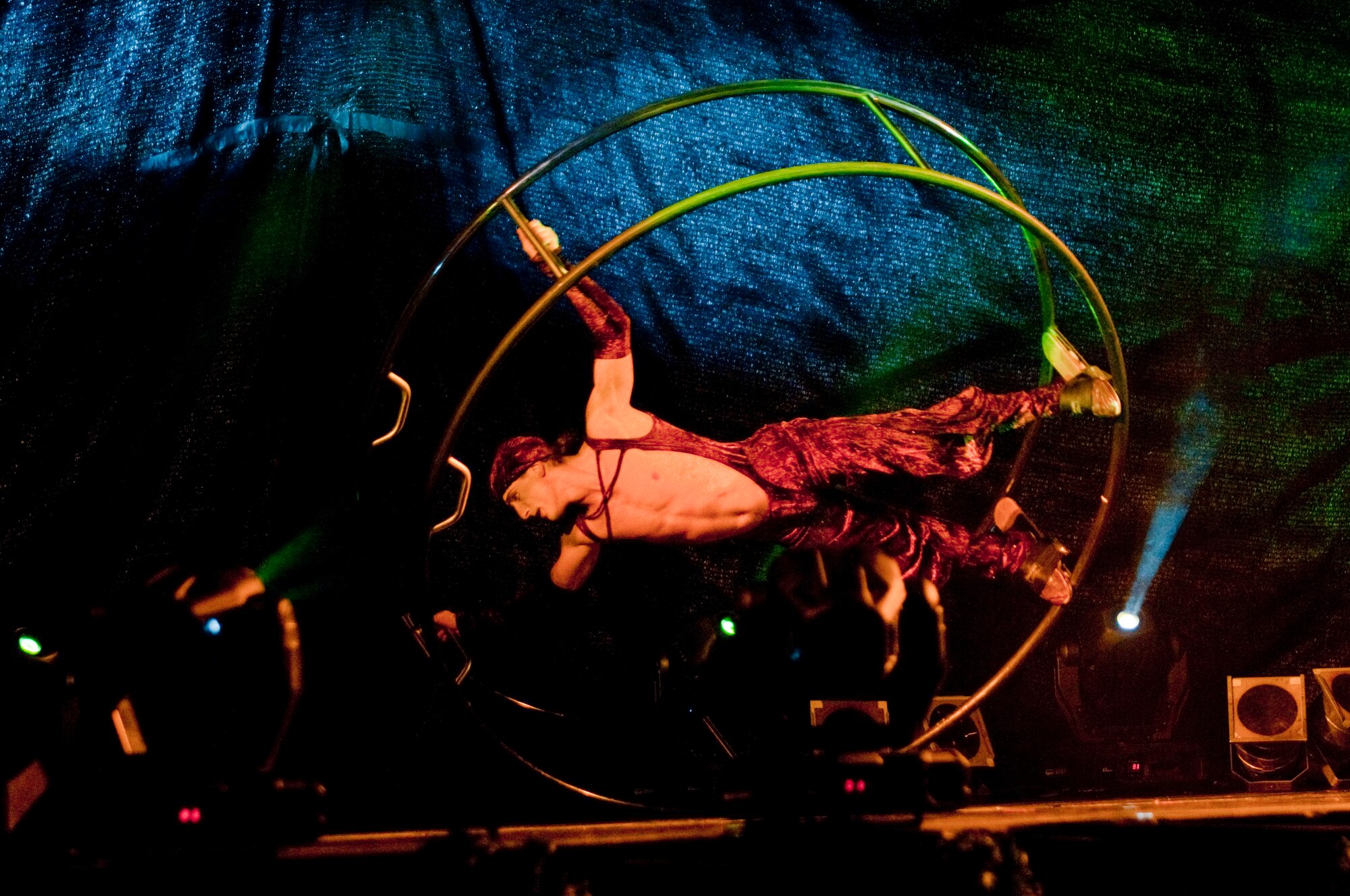 KUNSAN AIR BASE, Republic of Korea -- A member of the Cirque Dreams Holidaze balances on a spinning circle during the show here Dec. 8. The Cirque Dreams Holidaze show, which was brought here as part of the Pacific Armed Forces Entertainment tour, featured an international cast of acrobats, aerialists and dancers displaying the wonders of the holidays. (U.S. Air Force photo by/ Senior Airman Jonathon Steffen)