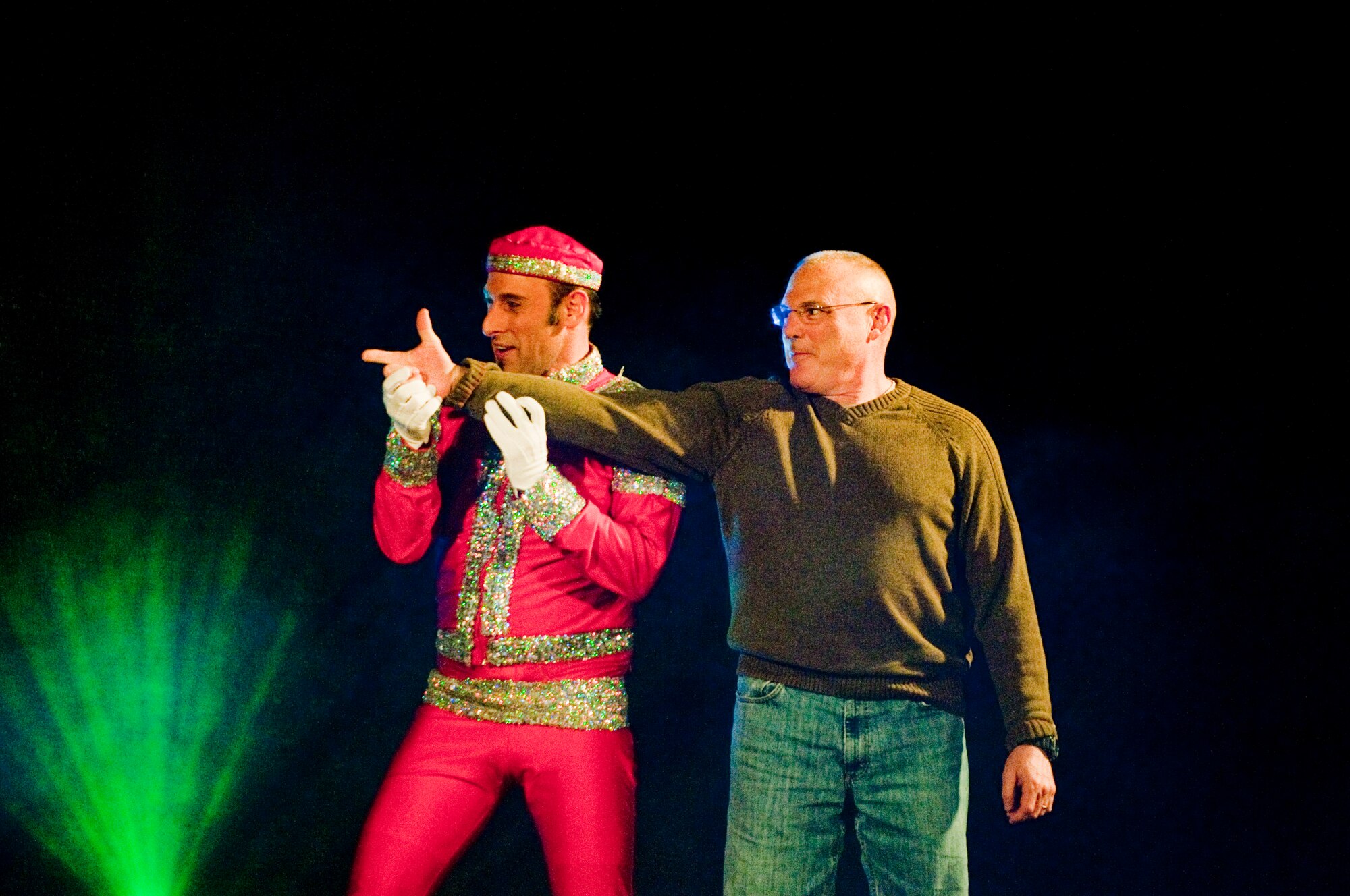 KUNSAN AIR BASE, Republic of Korea -- Lt. Col. Kurtis Faubion, 8th Medical Support Squadron commander, participates in a short pantomimic performance with one of the perfomers of the Cirque Dreams Holidaze show here Dec. 8. The Cirque Dreams Holidaze show, which was brought here as part of the Pacific Armed Forces Entertainment tour, featured an international cast of acrobats, aerialists and dancers displaying the wonders of the holidays. (U.S. Air Force photo by/ Senior Airman Jonathon Steffen)