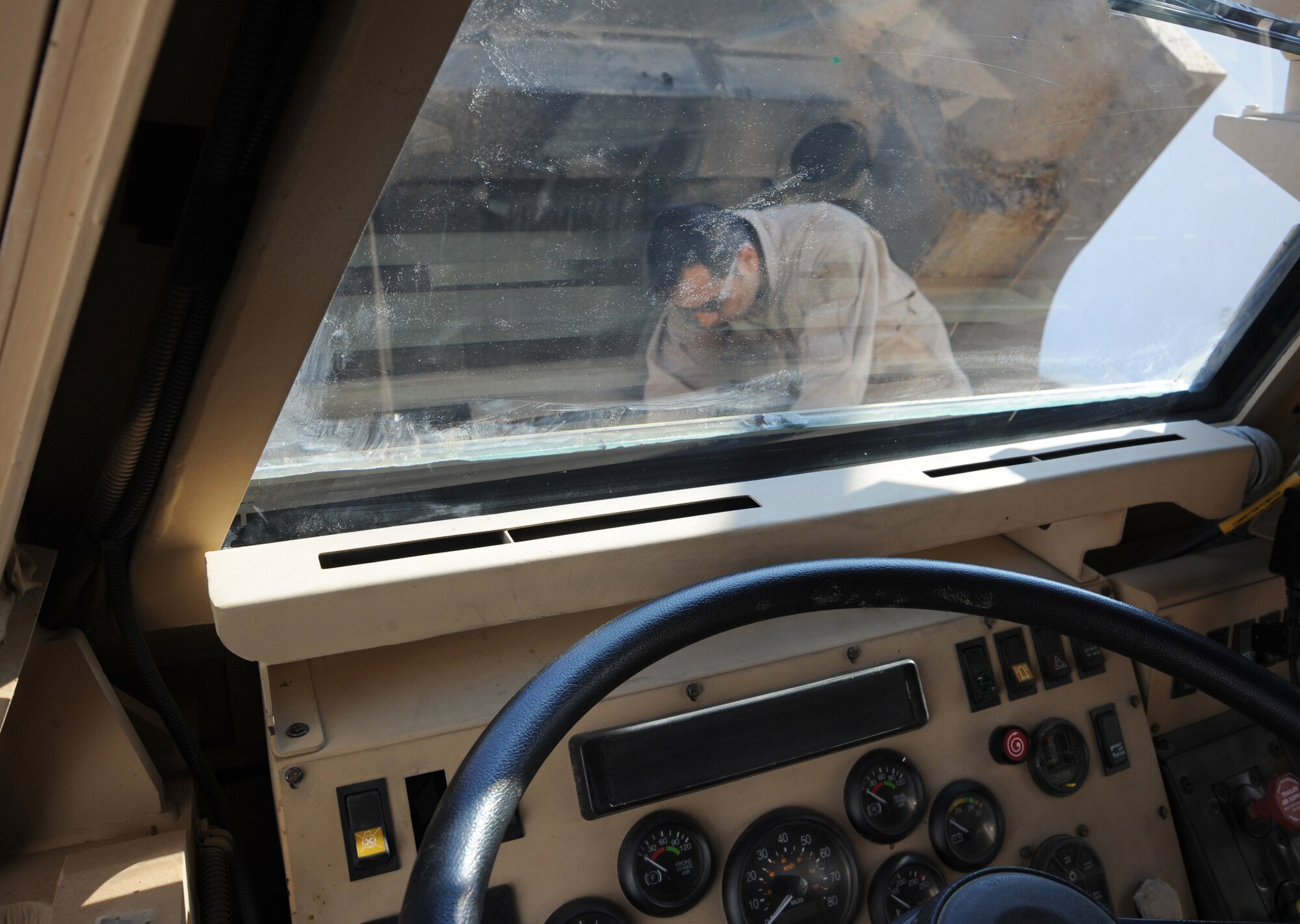 CAMP TAJI, Iraq -- Air Force Staff Sgt. Jose Rodriguez, 732nd Expeditionary Security Forces Squadron Detachment 3 vehicle mechanic, performs maintenance on an MRAP Dec. 11, 2009. Five vehicle maintainers are attached to the unit to keep these life-saving vehicles operational.  Sergeant Rodriguez is deployed from Cannon Air Force Base, N.M. and hails from San Antonio, TX. (U.S. Air Force photo/Master Sgt. Trish Bunting)