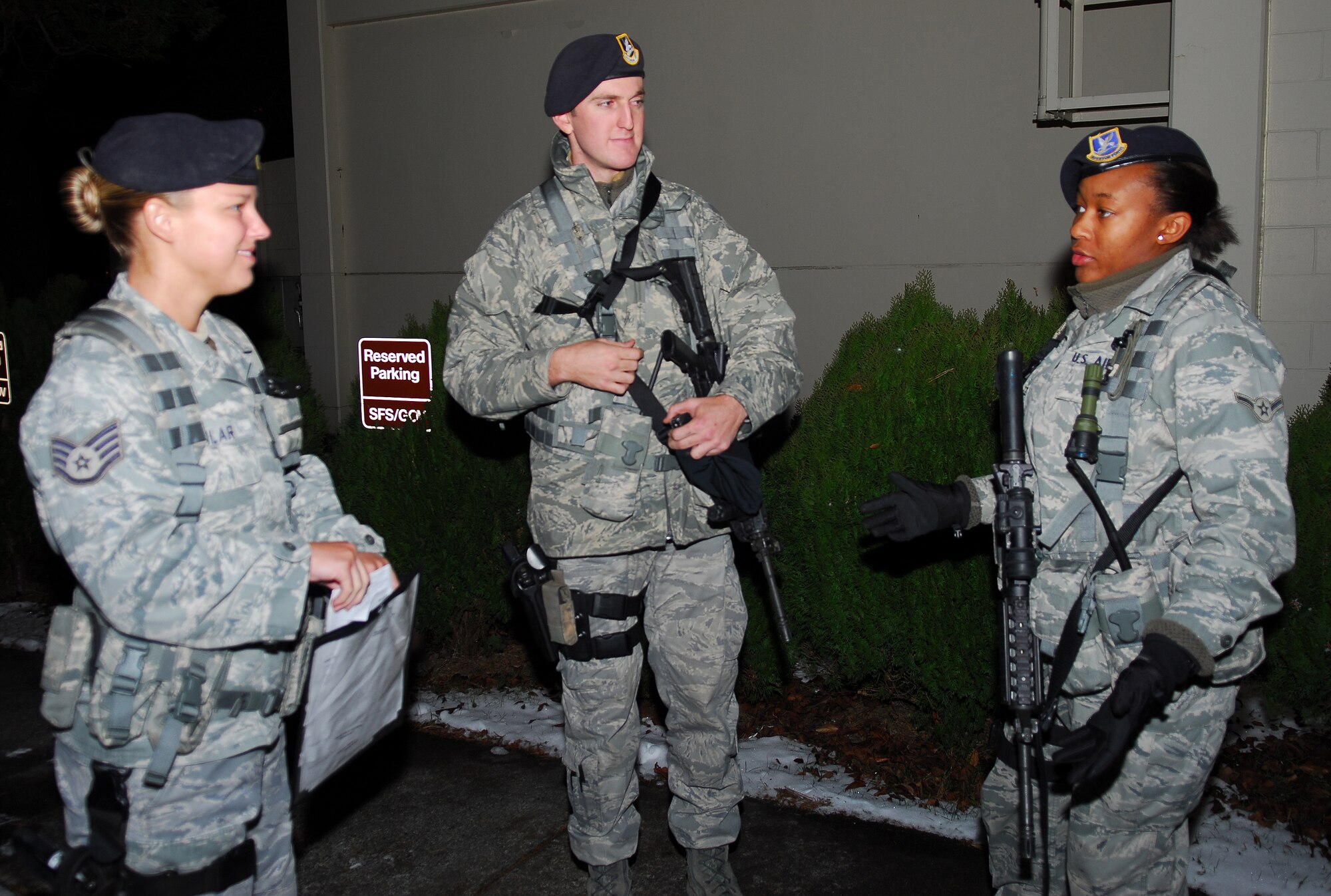 MISAWA AIR BASE, Japan – Staff Sgt. Sarah Aguilar, 35th Security Forces Squadron senior force protector, receives a shift turn over from Airmen Charles Flaster and Rondalyn Wofford, 35th SFS patrolman Dec. 18, during guard mount at the security forces building. Turnover is important during guard mounts, it aids in preparing the next shift of Airmen for duty. (U.S. Air Force photo/Staff Sgt. Phillip Butterfield)