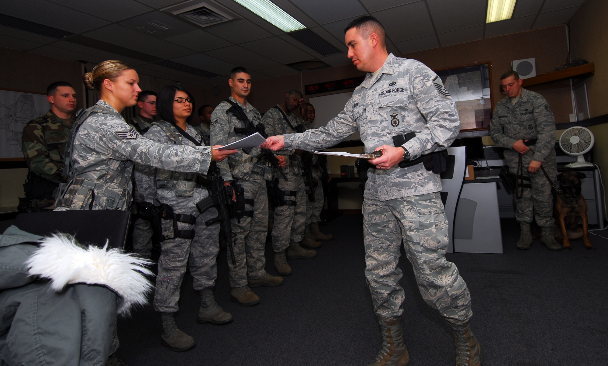 MISAWA AIR BASE, Japan – Master Sgt. Thomas Rodd, 35th Security Forces Squadron Bulldog Flight sergeant, briefs the outgoing patrolmen on duties and responsibilities Dec. 18, during guard mount at the security forces building.  Guard mount gives security forces members an opportunity to receive important information, inspect their equipment and draw a weapon before their shift.  (U.S. Air Force photo/Staff Sgt. Phillip Butterfield)
