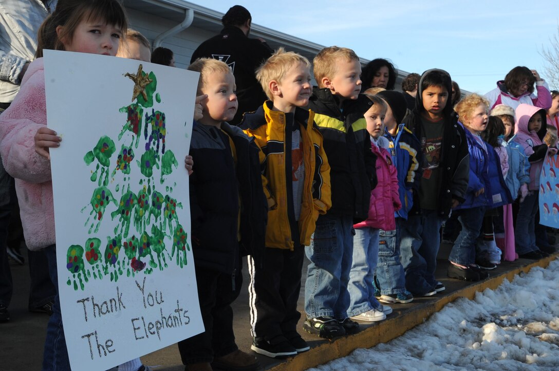 ELLSWORTH AIR FORCE BASE, S.D.-- Children of the Youth and Family Services child care center wait for Santa and Mrs. Claus' arrival in Rapid City, S.D., Dec. 17. This is the third time Santa, Mrs. Claus and Ellsworth Airmen bought, wrapped and delivered gifts for every child at the YFS child care center. (US Air Force photo/Airman 1st Class Corey Hook)