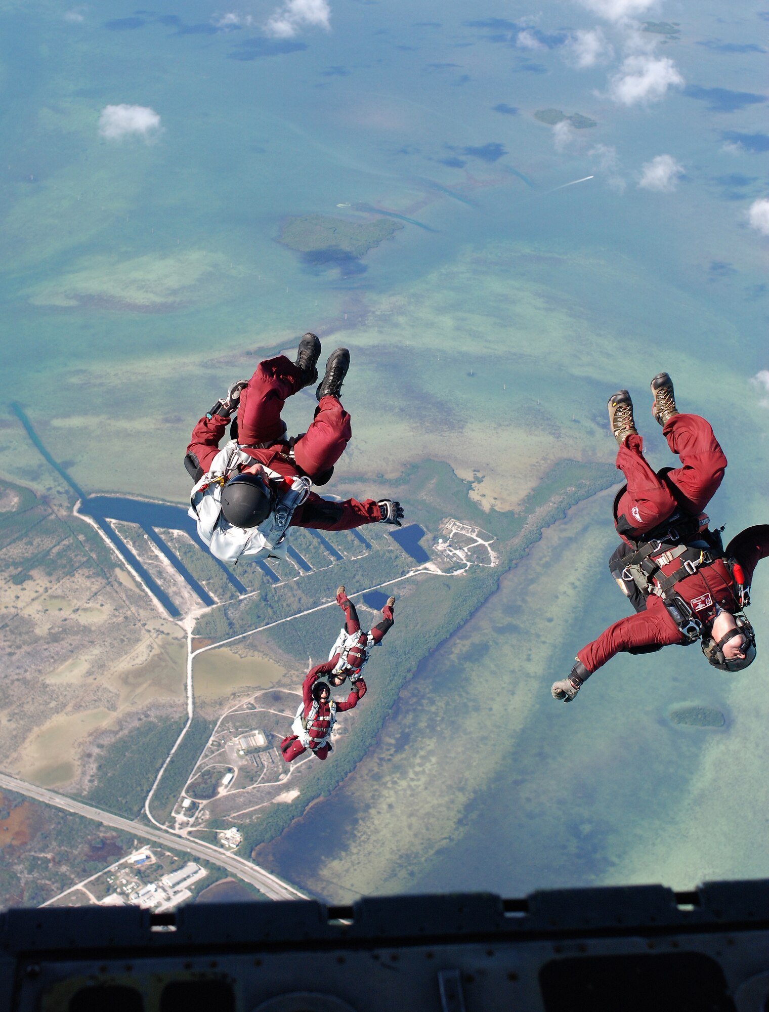 Key West, Fla. - 1st Lt. James Sluder and Tech Sgt. Wes Hufnagel, Air Force Reserve Pararescuemen, PJs, from the 920th RQW, jump during the HALO exercise at the 2009 SAREX. The PJs free-fall for about 2,500 feet before they deploy their parachutes. (U.S. Air Force Photo/Staff Sgt. Leslie Kraushaar)