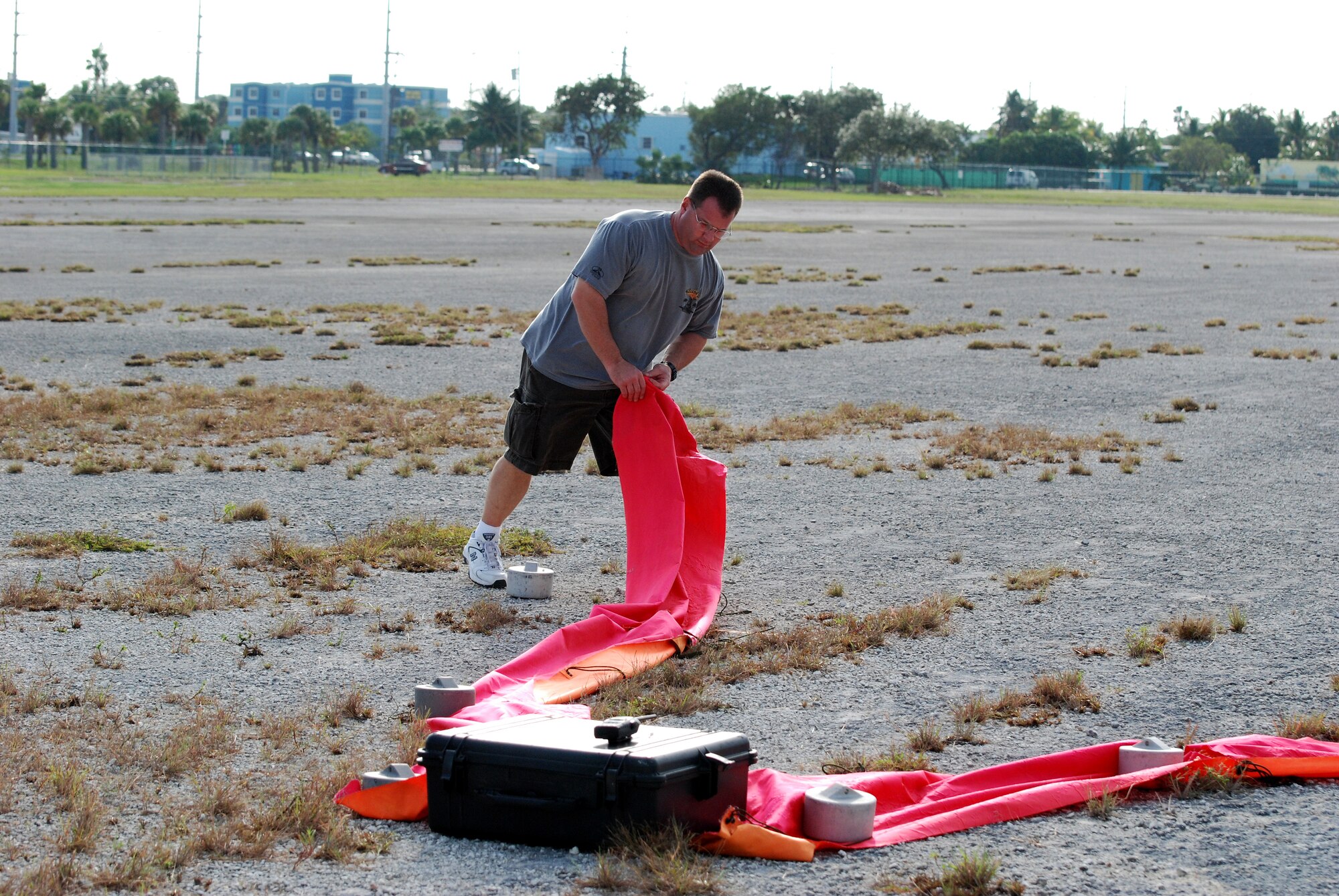 Key West, Fla. - Chief Master Sgt. Donald Rouse, from the 920th Rescue Wing, marks the landing area where the HC-130/N crew are to drop their packages during the 2009 SAREX in Key West. The importance of this drill comes when life support equipment needs to be dropped to survivors during a search and rescue event. The crew and pilots of the HC-130/N, or King, are well-prepared in case of any emergency. (U.S. Air Force Photo/Staff Sgt. Leslie Kraushaar)
