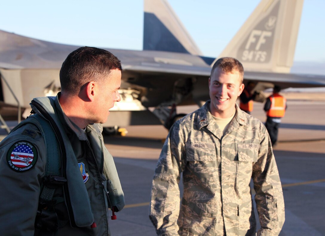 Col. Matthew "Zap" Molloy (left), commander of the 1st Fighter Wing at Langley Air Force Base, Va., talks with 2nd Lt. Phillip Wilson, 80th Operations Support Squadron, Dec. 17 at Sheppard Air Force Base, Texas, after the colonel performed a few low approaches. The colonel was the guest speaker at the 80th FlyingTraining Wing's Euro-NATO Joint Jet Pilot Training Program graduation Dec. 18 in the base theater. (U.S. Air Force photo/Lt. Col. Ternell Washington)