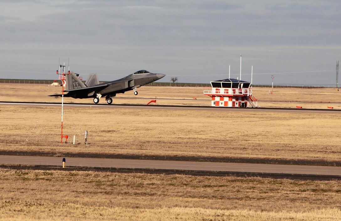 Col. Matthew "Zap" Molloy comes in for a landing Dec. 17 in an F-22/A Raptor at Sheppard Air Force Base, Texas. The 1st Fighter Wing commander was the guest speaker at the Dec. 18 graduation of the Euro-NATO Joint Jet Pilot Training Program's Class 10-02. (U.S. Air Force photo/Lt. Col. Ternell Washington)
