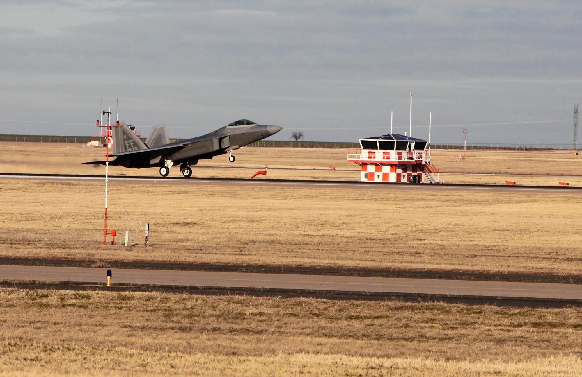 Col. Matthew "Zap" Molloy comes in for a landing Dec. 17 in an F-22/A Raptor at Sheppard Air Force Base, Texas. The 1st Fighter Wing commander was the guest speaker at the Dec. 18 graduation of the Euro-NATO Joint Jet Pilot Training Program's Class 10-02. (U.S. Air Force photo/Lt. Col. Ternell Washington)