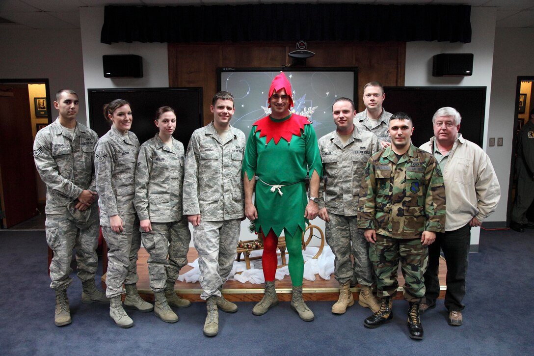 Members of the 80th Operations Support Squadron take time to pose with their commander, Lt. Col. Michael "Strike" Messer (center), Dec. 18 after the colonel won the "You Got Elf'd" fundraiser with 760 votes. Proceeds from the fundraiser went to less fortunate families in the Wichita Falls area to help them have a happy holiday. (U.S. Air Force photo/Lt. Col. Ternell Washington)