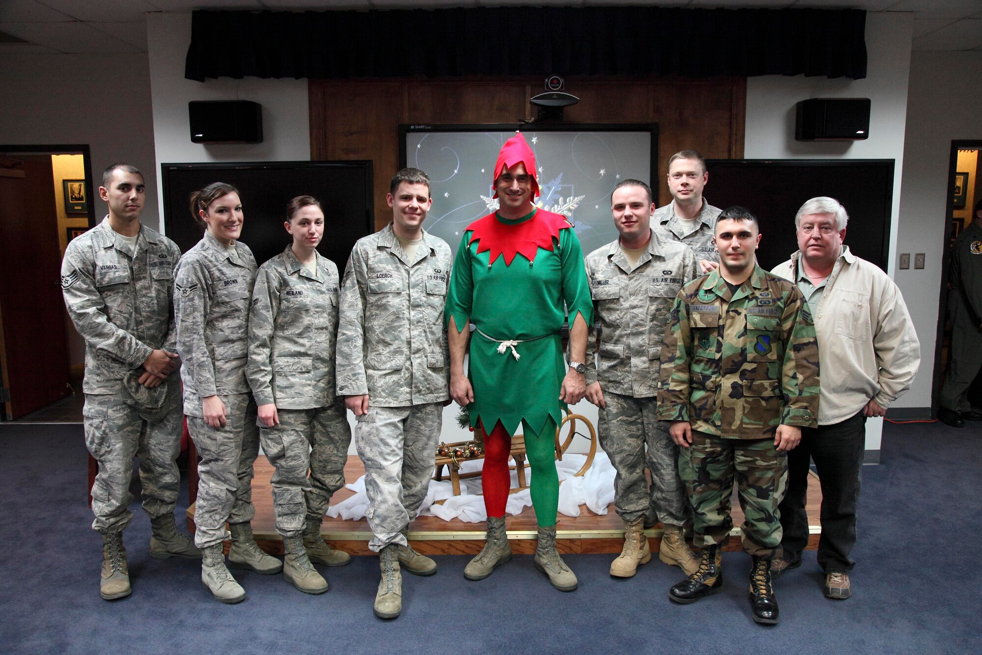 Members of the 80th Operations Support Squadron take time to pose with their commander, Lt. Col. Michael "Strike" Messer (center), Dec. 18 after the colonel won the "You Got Elf'd" fundraiser with 760 votes. Proceeds from the fundraiser went to less fortunate families in the Wichita Falls area to help them have a happy holiday. (U.S. Air Force photo/Lt. Col. Ternell Washington)