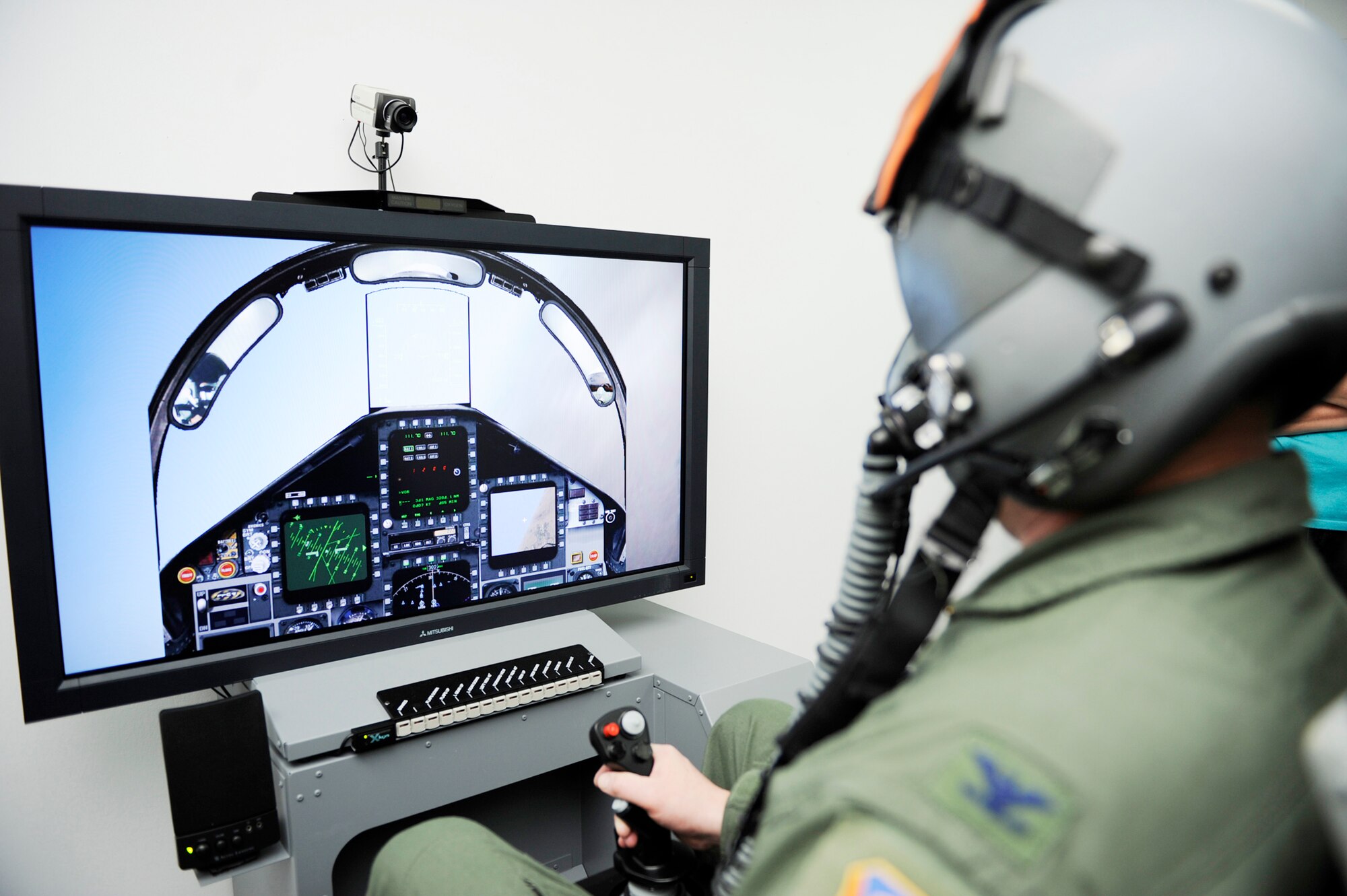 Col. James McGovern, 366th Operations Group commander, tests the simulator-based hypoxia demonstrator for fighter aircrew Dec. 16, 2009 at Mountain Home Air Force Base, Idaho. Hypoxia is an oxygen deficiency of the tissue and blood cells that causes impairment at high altitudes. (U.S. Air Force photo/Airman 1st Class Renishia Richardson)
