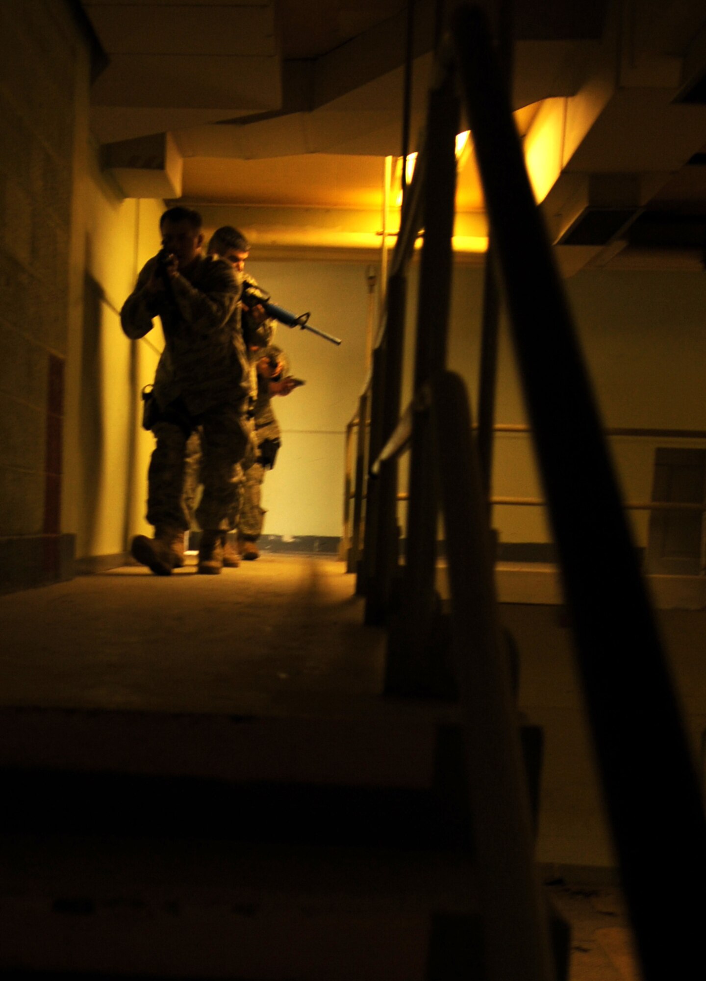HOLLOMAN AIR FORCE BASE, N.M. -- Members of the 49th Security Forces Squadron practice clearing a building during "First Responder to an Active Gunman" training Dec. 17. The training allowed the defenders to practice the proper techniques to safely eliminate any emergency situation that could occur on base, particularly in an active gunman scenario. (U.S. Air Force photo by Airman 1st Class Sondra Escutia)