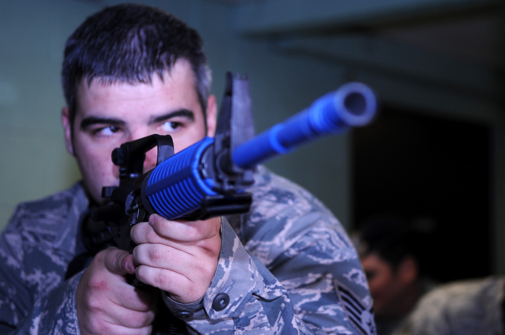 HOLLOMAN AIR FORCE BASE, N.M. -- Staff Sgt. Matthew Bowker, 49th Security Forces Squadron, practices clearing a building during training Dec. 17. The defenders were participating in "First Responder to an Active Gunman" training taught by members of the Roswell Police Department Special Operations Team. The training allowed the defenders to practice the proper techniques to safely eliminate any emergency situation that could occur on base, particularly in an active gunman scenario. (U.S. Air Force photo by Airman 1st Class Sondra Escutia)