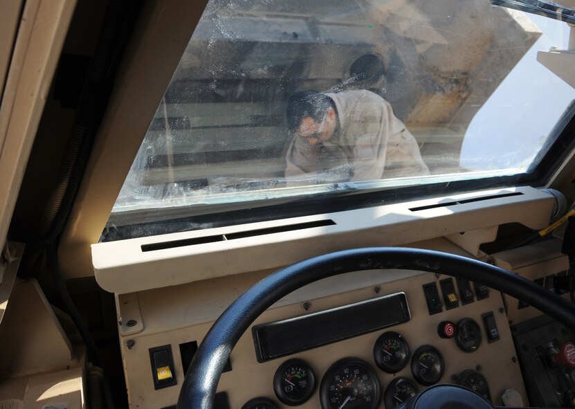 Staff Sgt. Jose Rodriguez, a 732nd Expeditionary Security Forces Squadron vehicle mechanic at Camp Taji, Iraq, performs maintenance on a mine resistant ambush protected vehicle Dec. 11, 2009. Five vehicle maintainers are attached to the unit to keep these life-saving vehicles operational.  Sergeant Rodriguez is deployed from Cannon Air Force Base, N.M., and hails from San Antonio. (U.S. Air Force photo/Master Sgt. Trish Bunting)