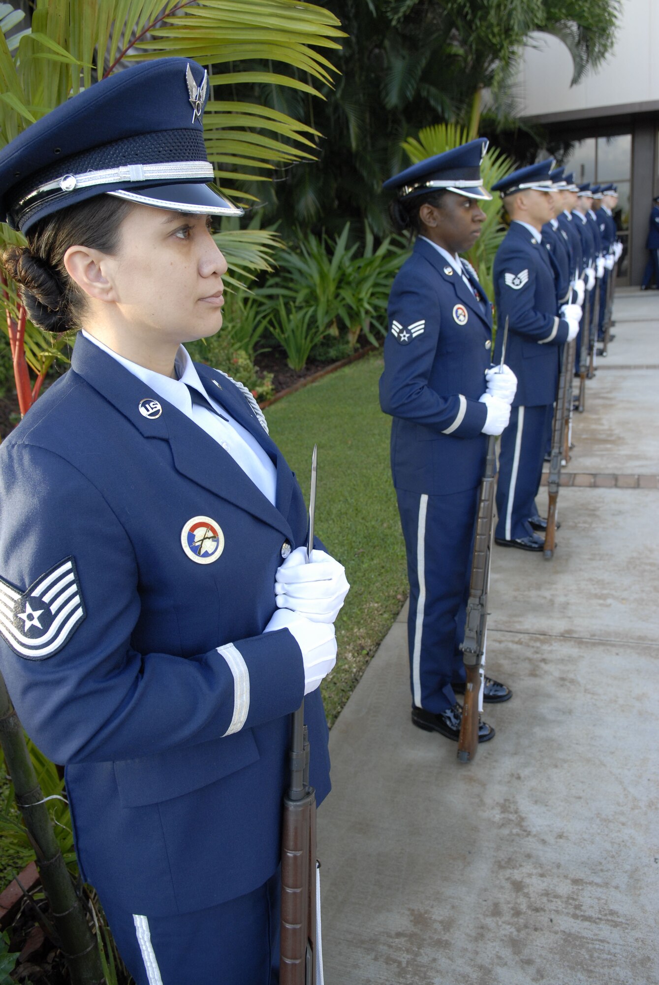 HICKAM AIR FORCE BASE, Hawaii ? Members of the Hickam Air Force Base Honor Guard, stand at parade rest as part of the cordon that welcomed the Honorable Michael Donley, Secretary of the Air Force, to Pacific Air Forces Command here, Dec. 18. Hickam Air Force Base is his first stop of his tour of air bases in PACAF. PACAF is responsible for Air Force activities spread over half the globe in a command that supports 45,000 Air Force people serving principally in Hawaii, Alaska, Guam, Korea, and Japan. (U.S. Air Force photo/Tech. Sgt. Jerome Tayborn) 
