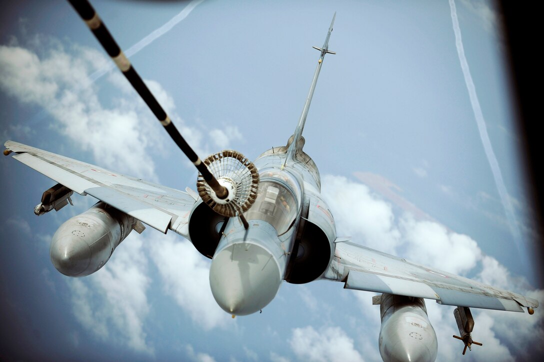 A French Mirage 2000 is refueled by a 908th Expeditionary Air Refueling Squadron KC-10A Extender during a multinational exercise, Dec. 6, 2009, in Southwest Asia. Aircrews from France, Jordan, Pakistan, the U.K., and the U.S. trained together in the U.S. Air Forces Central area of responsibility in fighting a large-scale air war. (U.S. Air Force photo/Staff Sgt. Michael B. Keller) 