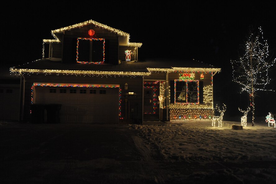 MINOT AIR FORCE BASE, N.D. -- A house stands illuminated with holiday cheer in base housing here Dec. 21. Many people on base celebrate the holiday season by decorating their houses and lawns in lights. Base residents don't let the weather conditions stop them from celebrating the holidays in style. (U.S. Air force photo by: Staff Sgt. Stacy Moless)