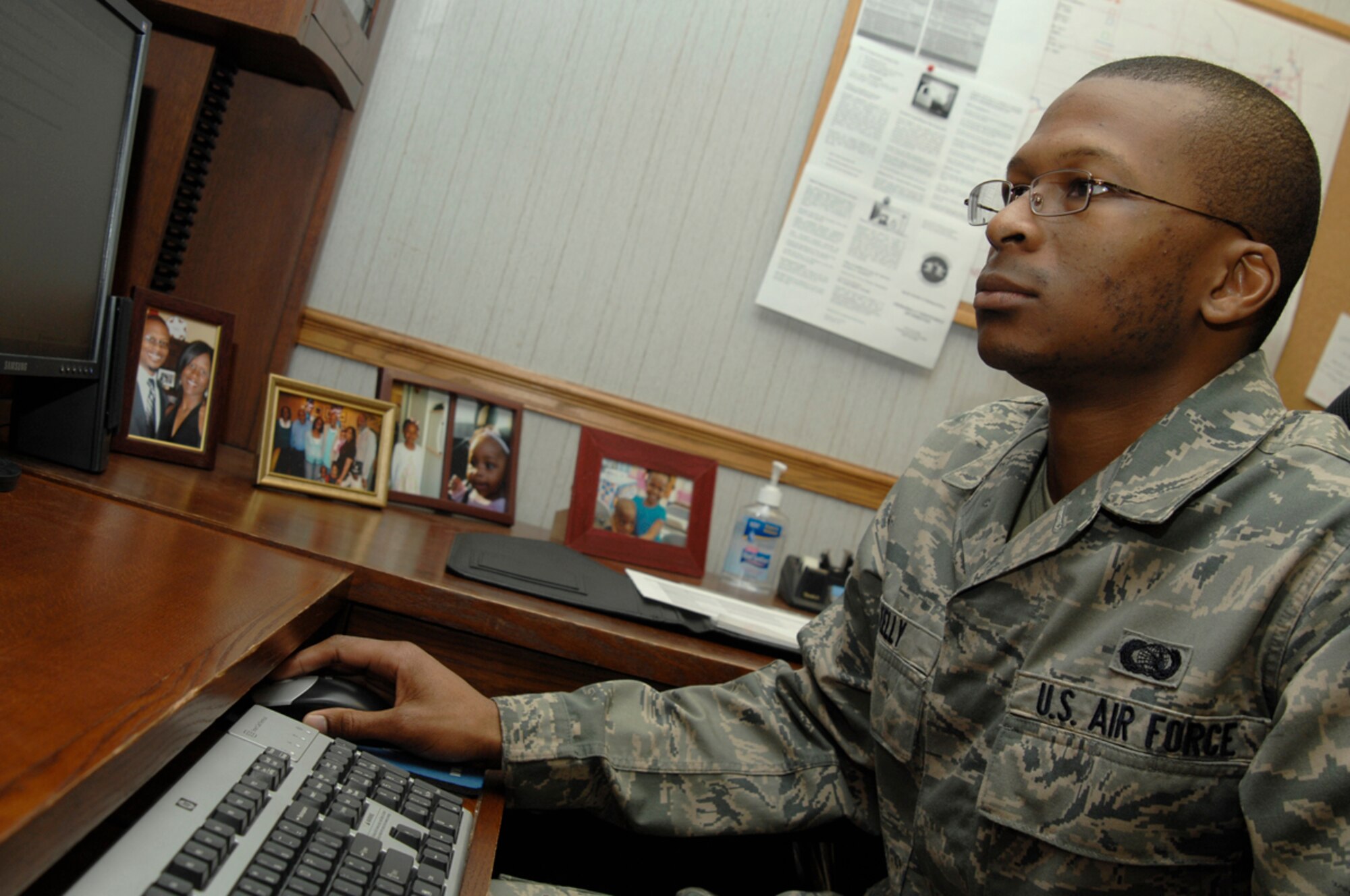 Airman 1st Class Darryl Kelly works on a 500-day plan, outlining the 22nd Communication Squadron’s ongoing projects, Dec. 12, 2009, at McConnell Air Force Base, Kan.  The Newport News, Va., native is a project manager for the 22nd CS. (U.S. Air Force photo/Senior Airman Jessica Lockoski) 