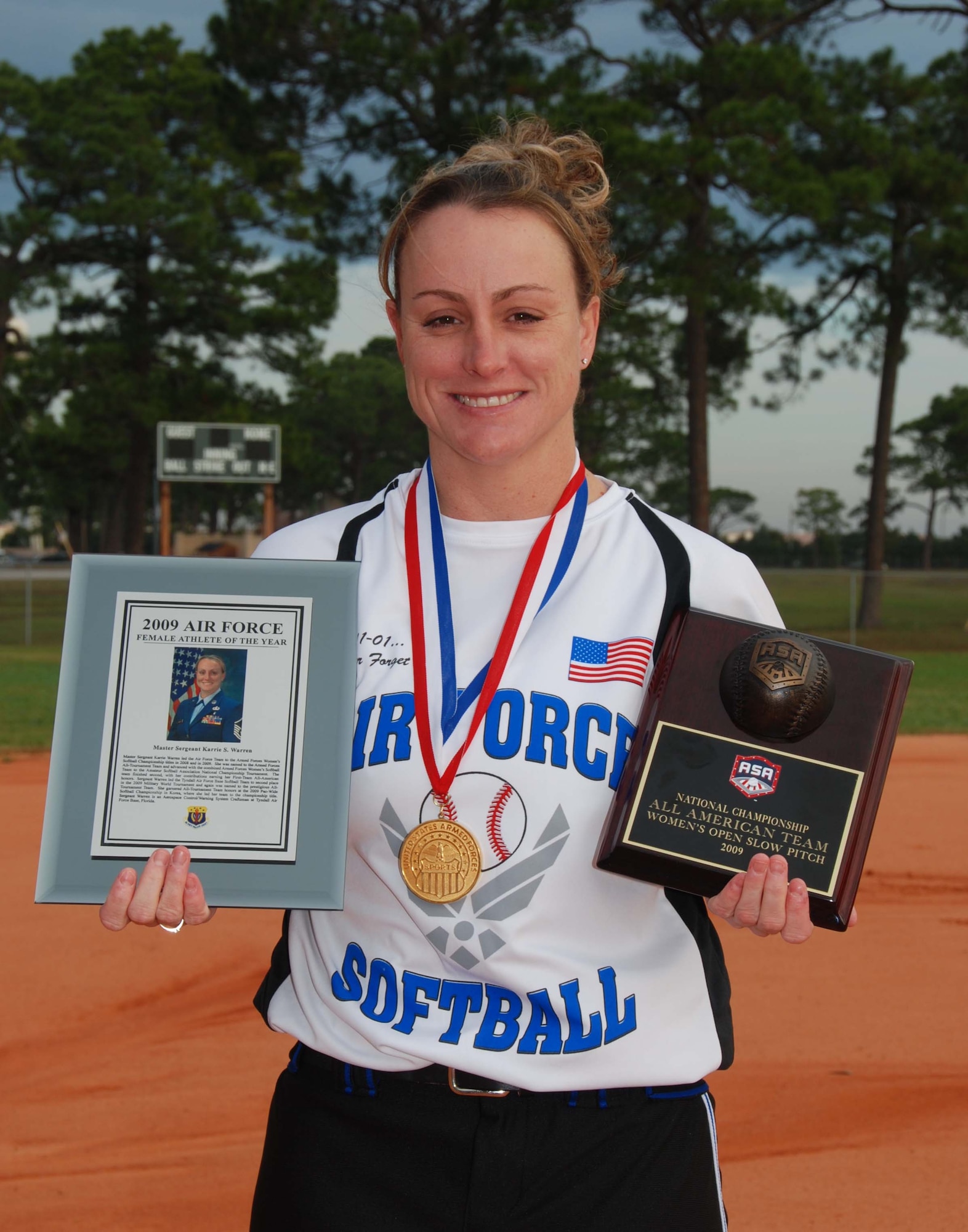 Master Sgt. Karrie Warren, member of the 601st Air and Space Operations Center, displays awards won at this year's 2009 Athletic Business Conference in Orlando.  Sergeant Warren was awarded the 2009 U.S. Air Force Female Athlete of the Year. (U.S. Air Force Photo by Maj. Steve Burke)