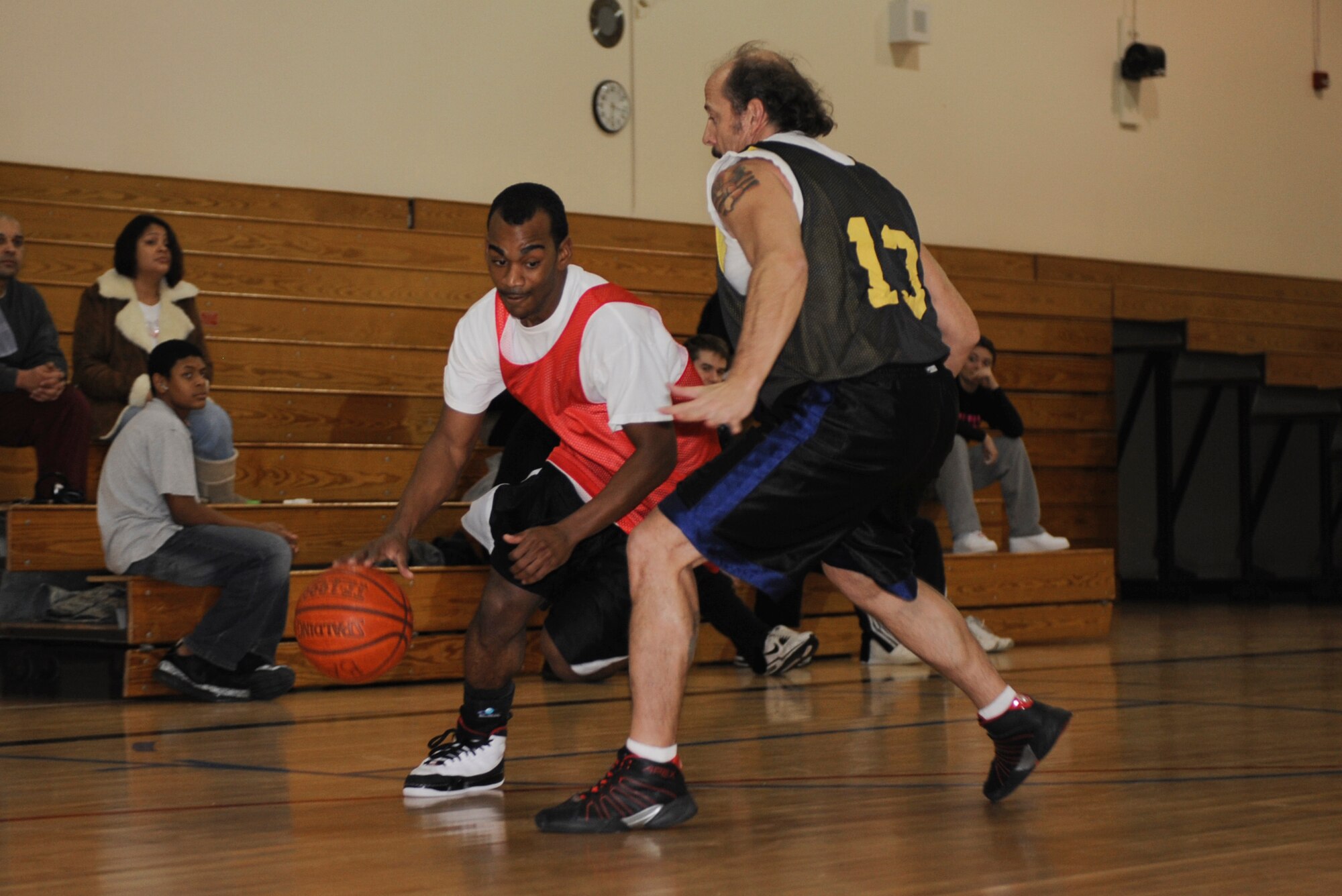 MOUNTAIN HOME AIR FORCE BASE, Idaho -- Leon Washington, 366th Component Maintenance Squadron shooting guard, drives past a defender from the 366th Security Forces Squadron during an intramural basketball game Dec. 15. CMS upset an undefeated SFS 46-45. (U.S. Air Force photo by Airman 1st Class Renishia Richardson)