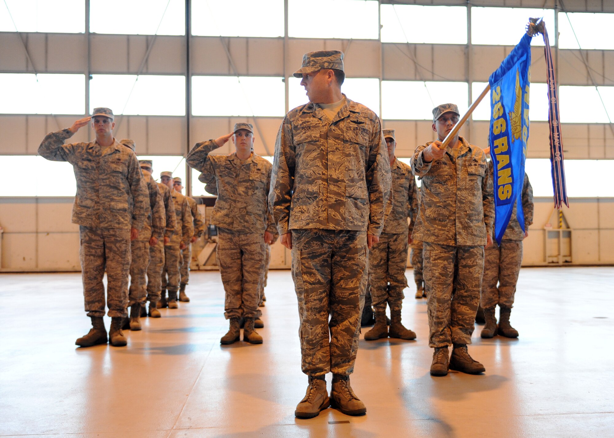 MOUNTAIN HOME AIR FORCE BASE, Idaho -- The 266th Range Squadron gives their first salute to Lt. Col. William Michell, 266th RANS incoming commander, during a change-of-command ceremony Dec. 15 in hangar 201. Colonel Michell received command from Lt. Col. Derek Newland. (U.S. Air Force photo by Airman 1st Class Debbie Lockhart)