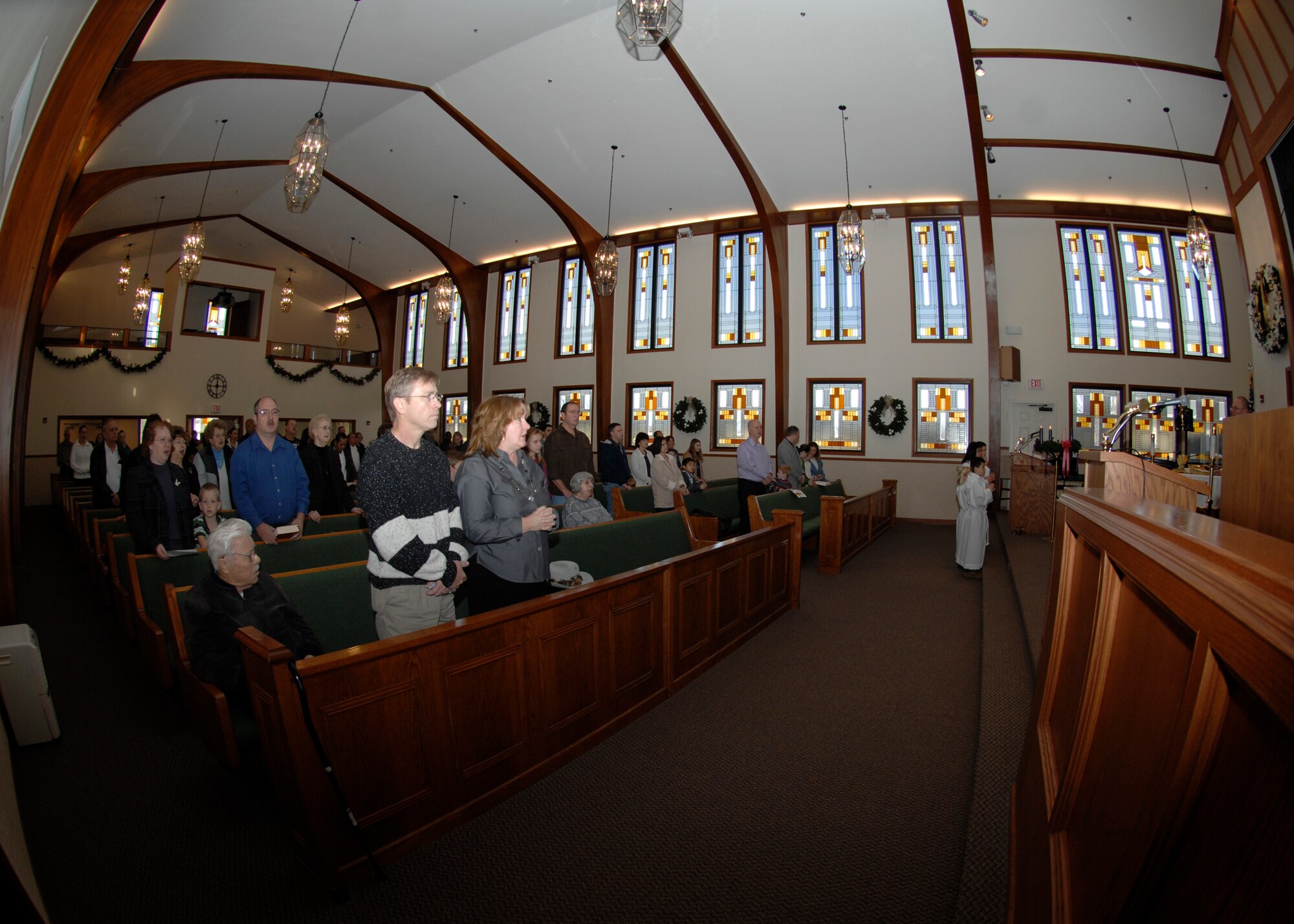 Team McConnell members attend a Catholic Mass, Dec. 6, 2009, at the McConnell Air Force Base, Kan., Chapel. The McConnell Chapel also provides Protestant services and, by request, can facilitate the religious needs of people from other faith groups such as Orthodox Christian, Jewish and Muslim. (U.S. Air Force Photo/Airman 1st Class Justin Shelton)