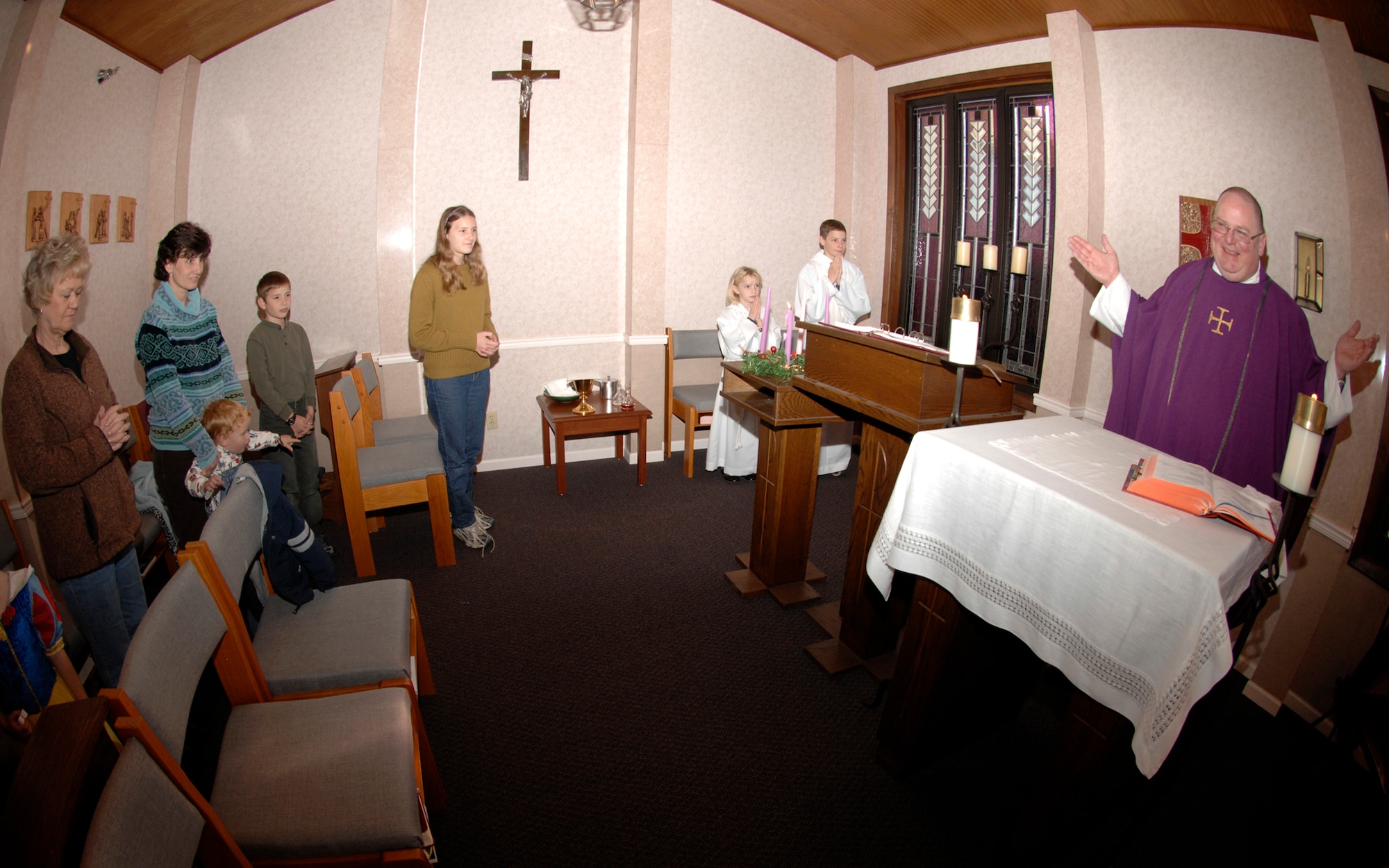 Father Jon Hotze, 22nd Air Refueling Wing Chaplain Corps, conducts a daily mass service, Dec. 2, 2009, at the base chapel at McConnell Air Force Base, Kan. Father Hotze is a civilian catholic priest at McConnell. Other than conducting religious services on base, chaplains provide pastoral care though counseling and the notify leadership about Airmen’s spiritual needs, religious requirements and ethical issues that impact the wing’s mission. (U.S. Air Force Photo/Airman 1st Class Justin Shelton)